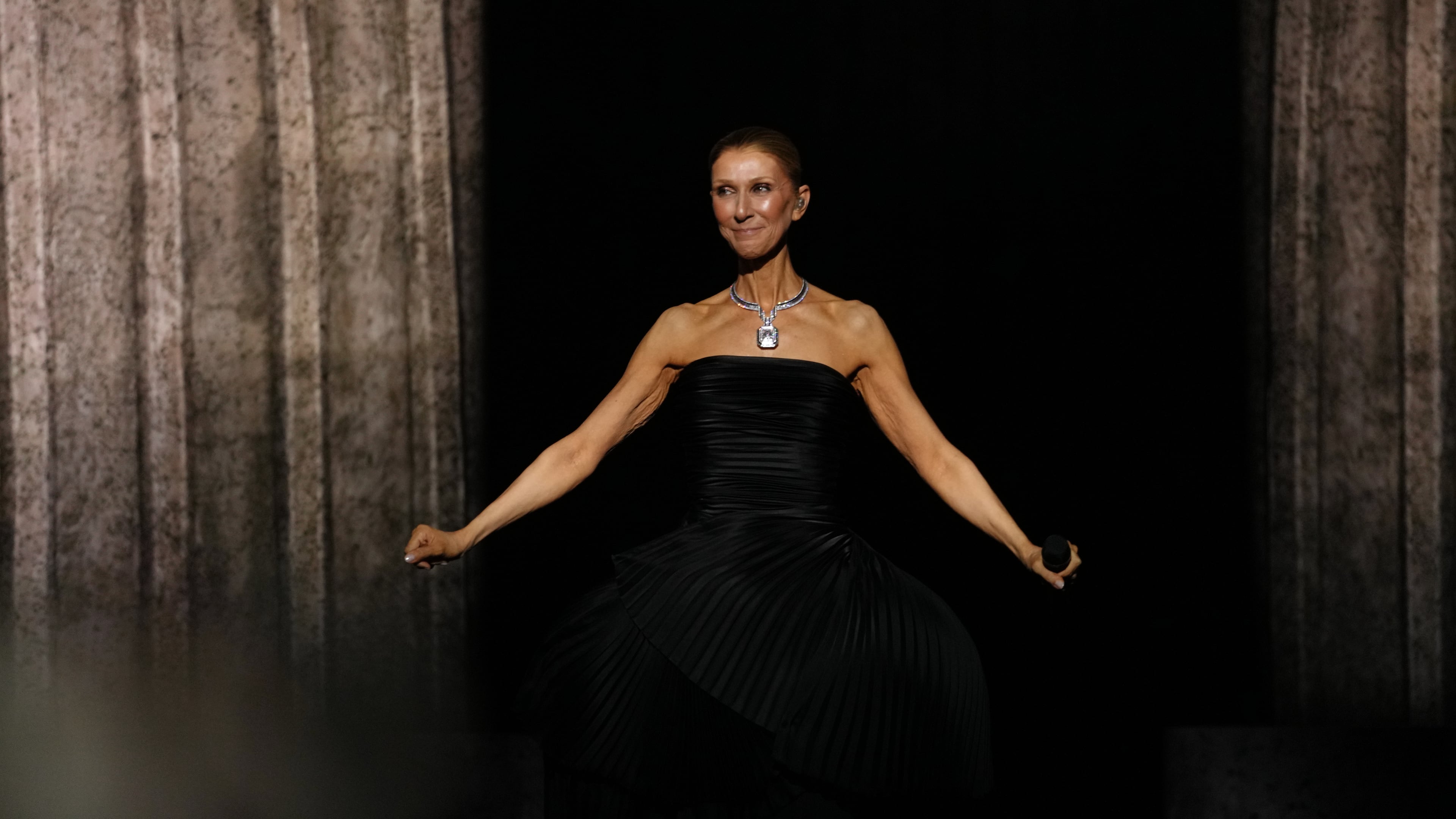 Singer Celine Dion performs during the opening concert of her 'Celine Dion Paris 2026' residency at the Plenitude Arena in Nanterre, outside Paris, Saturday, Sept. 12, 2026. (AP Photo/Aurelien Morissard)