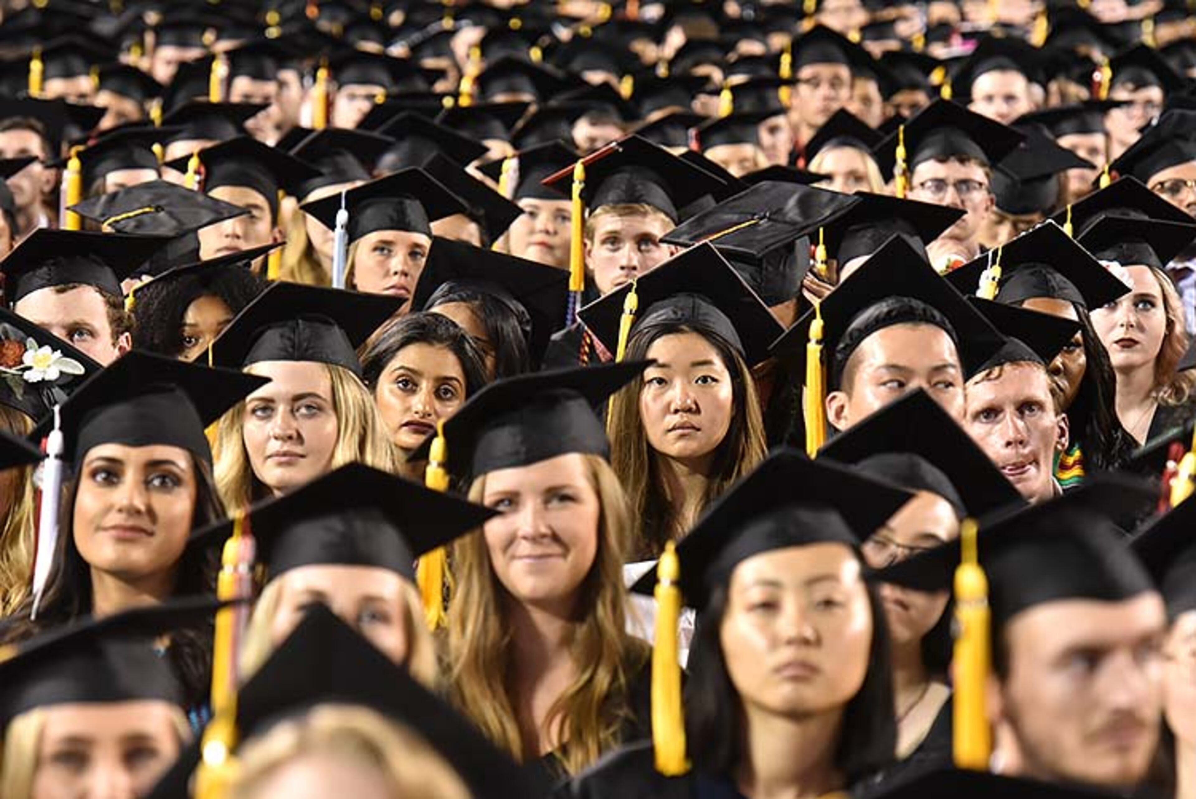 May 10, 2019 Athens - Students listen to commencement speaker Deborah Ann Roberts, news correspondent, during UGA's 2019 spring undergraduate commencement ceremony at Sanford Stadium in Athens on Friday, May 10, 2019. HYOSUB SHIN / HSHIN@AJC.COM