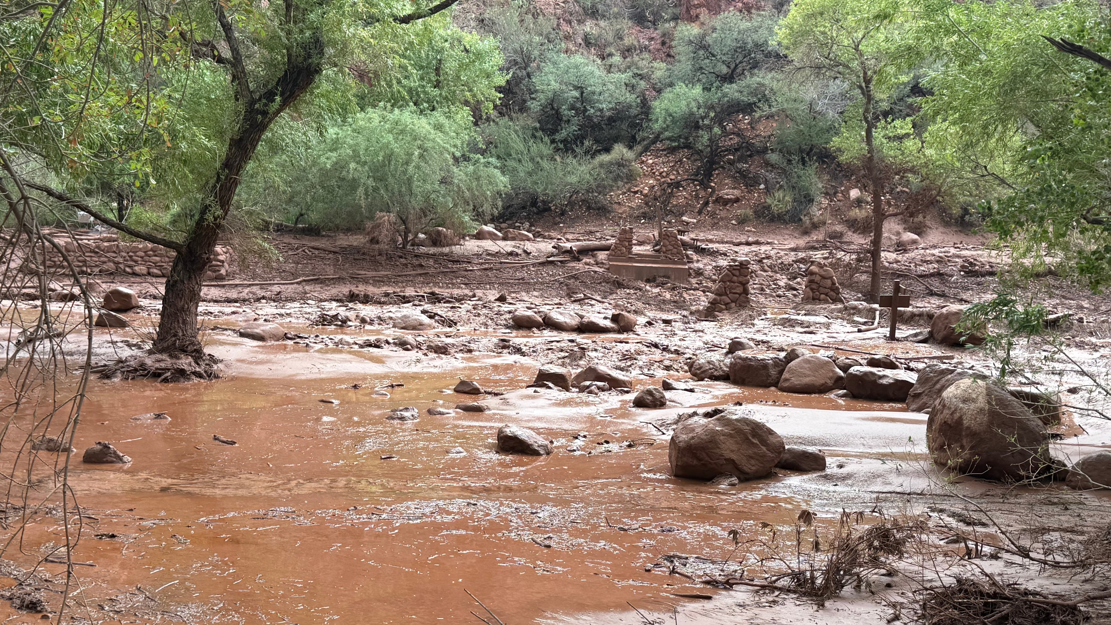 This photo provided by the National Park Service shows remnants of stone bridge pylons along Bright Angel Creek in the Grand Canyon following a flash flood that destroyed the footbridge, Saturday, Aug. 29, 2026. (James Thompson/National Park Service via AP)
