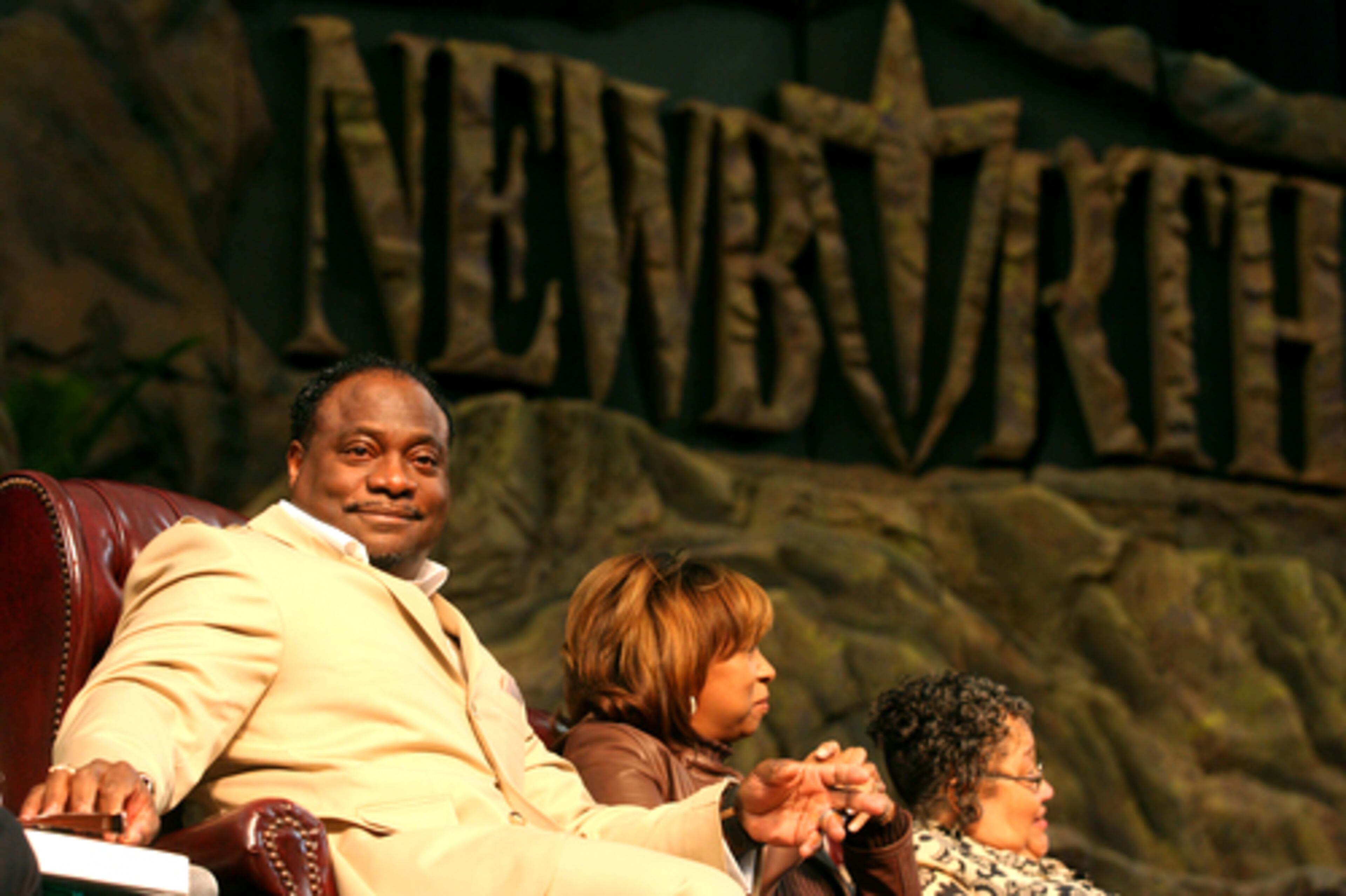 Bishop Eddie Long relaxes on a couch on the stage of the Georgia Dome during New Birth Missionary Baptist Church's Easter performance Sunday in 2008. The Dome said Wednesday that the annual service will not be held this year at the venue.