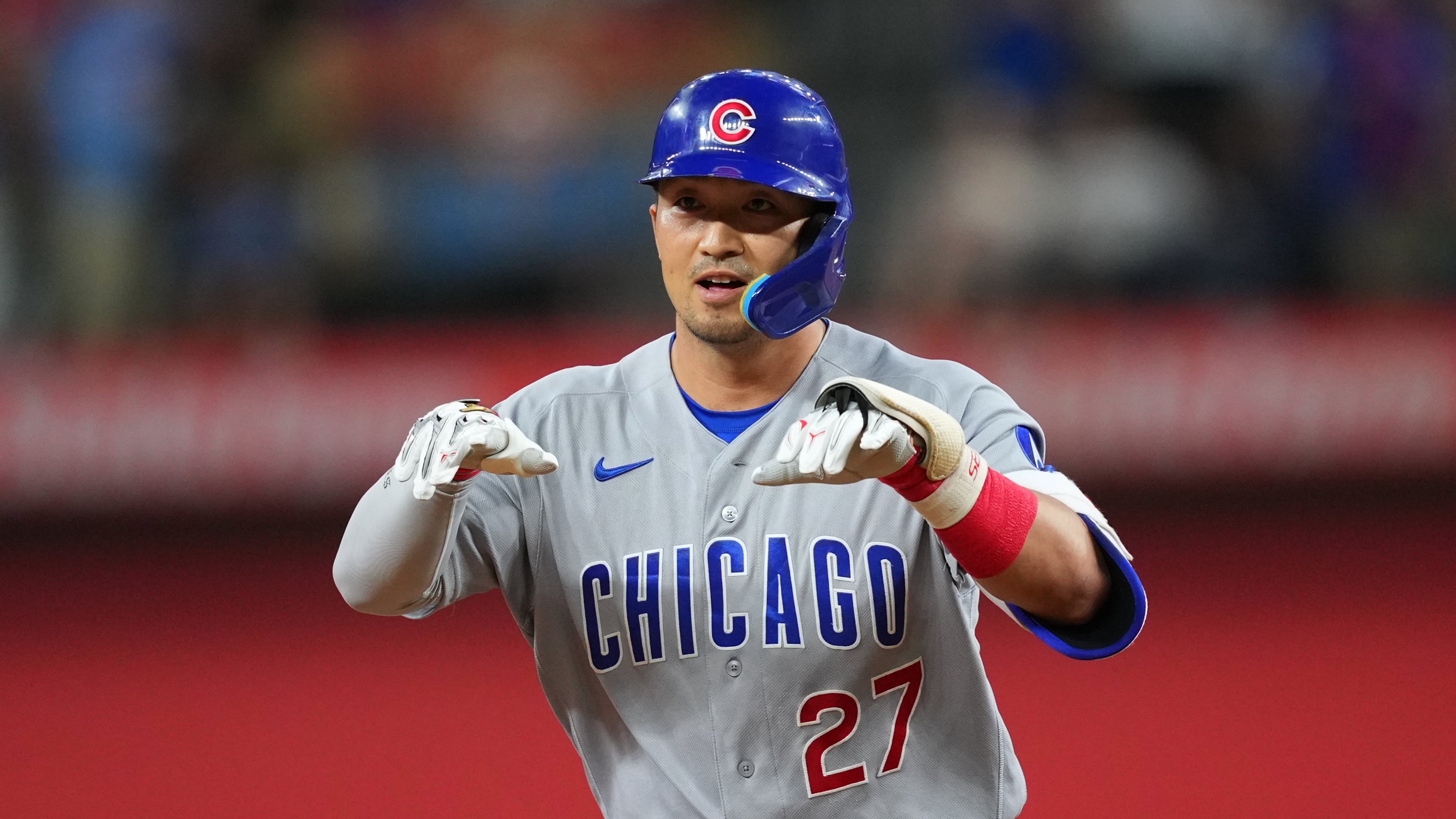 Chicago Cubs' Seiya Suzuki gestures while running the bases after hitting a two-run home run off Texas Rangers starting pitcher Kumar Rocker during the fourth inning of a baseball game Friday, May 8, 2026, in Arlington, Texas. (AP Photo/Julio Cortez)
