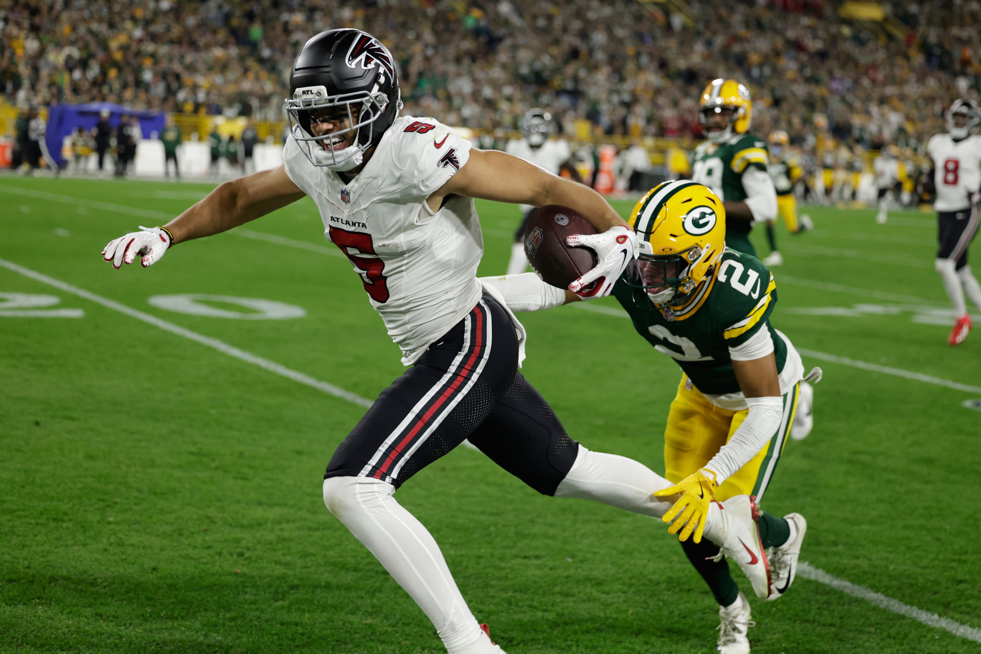 Falcons wide receiver Drake London (left) is stopped by Packers cornerback Brandon Cisse during their game at Lambeau Field on Thursday, Sept. 24, 2026, in Green Bay, Wis. (Matt Ludtke/AP)