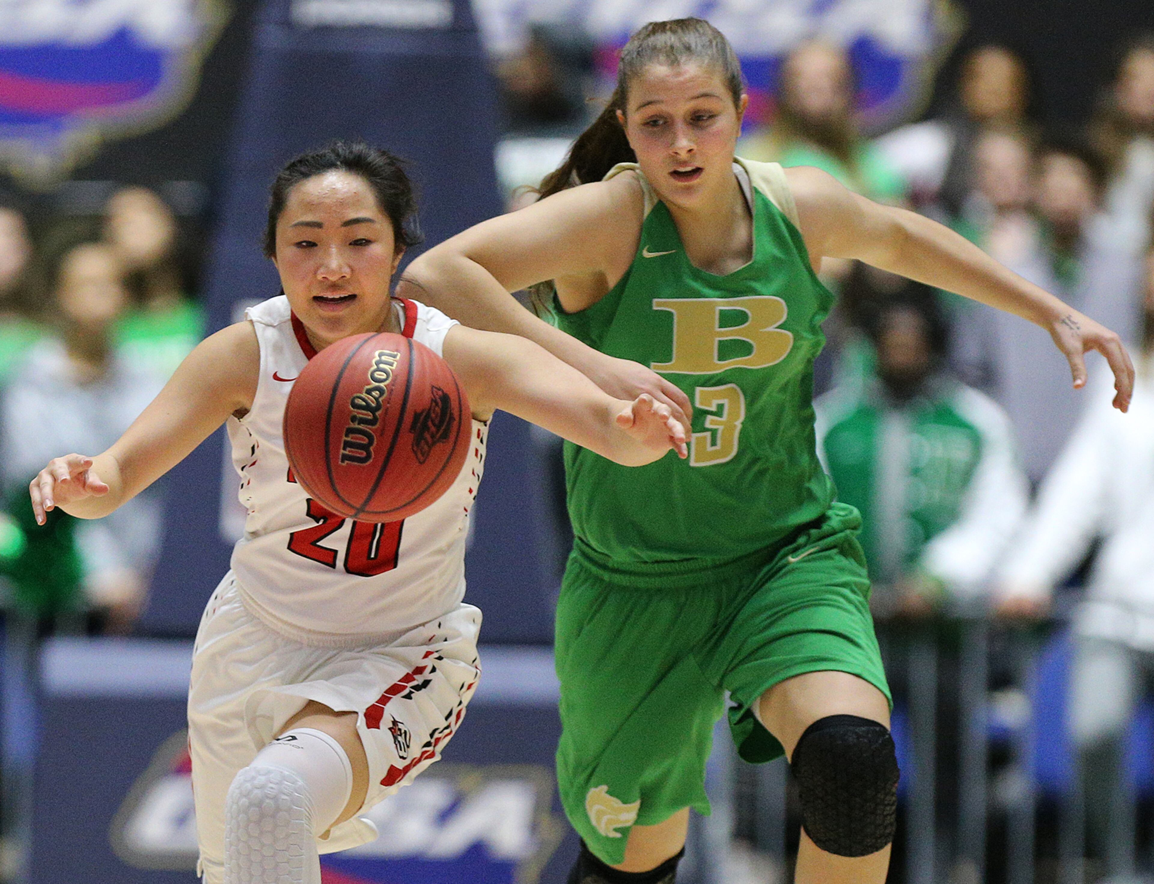 March 8, 2018 Macon: Buford guard Tate Walters and Flowery Branch guard Lexie Sengkhammee chase a loose ball in their GHSA state basketball championship game on Thursday, March 8, 2018, in Macon. Curtis Compton/ccompton@ajc.com
