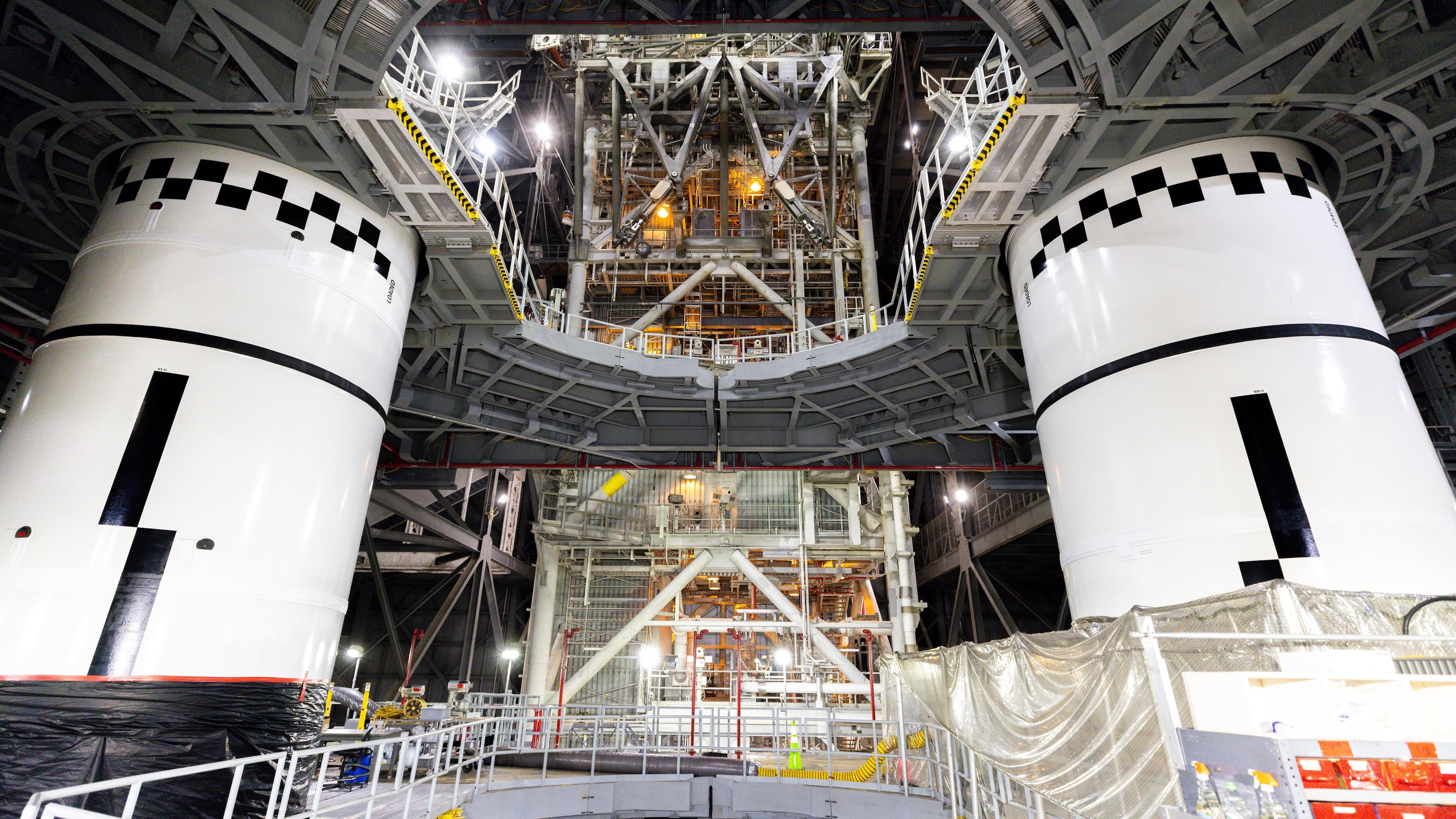 In this photo provided by NASA, the final left and right forward solid rocket booster motor segments for Artemis III are integrated onto the mobile launcher for the SLS (Space Launch System) rocket on Thursday, Sept. 24, 2026 at NASA's Kennedy Space Center in Florida. (Frank Michaux/NASA via AP)