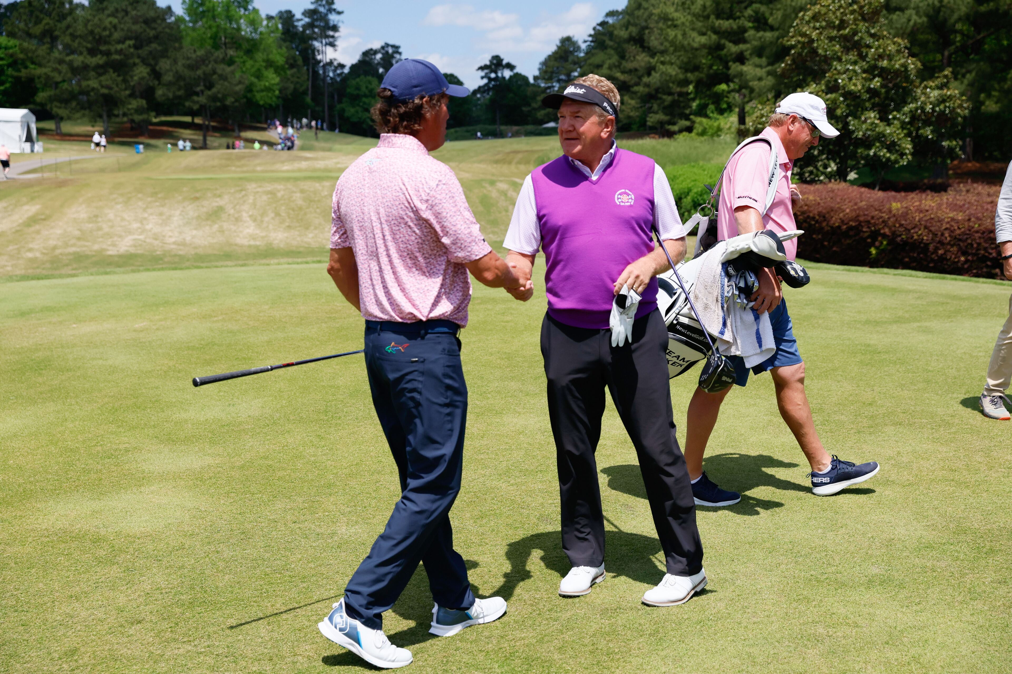 Stephen Ames greets Paul Broadhurst as they get ready to start the final round of the Mitsubishi Classic senior golf tournament at TPC Sugarloaf on Sunday, April 28, 2024, in Duluth, GA.
(Miguel Martinez / AJC)