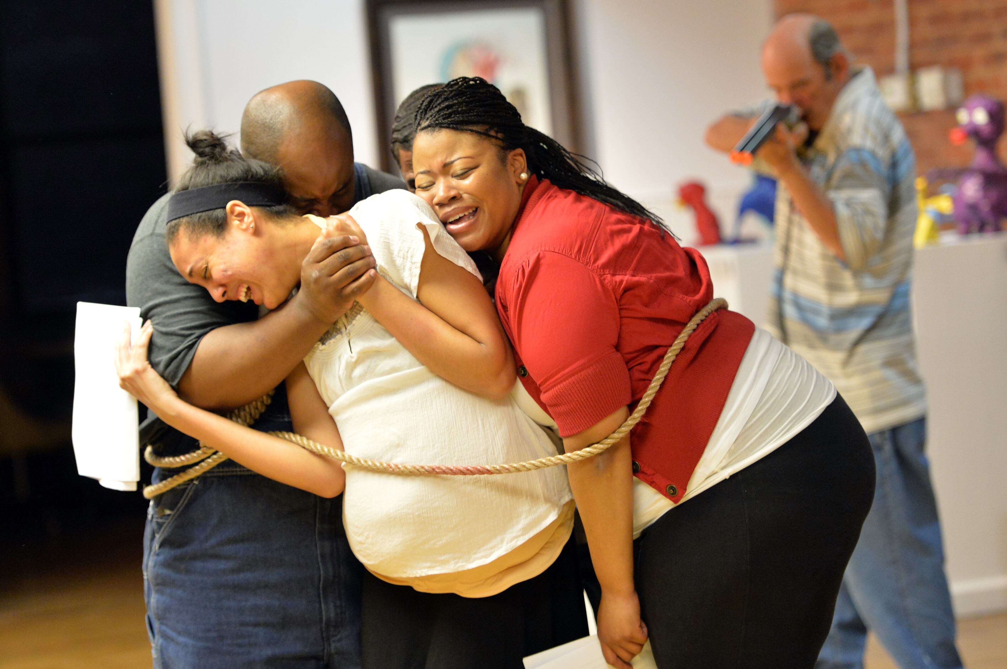 Casting members (from left) Tywayne Wheatt, Whitney Stallworth, Joseph Grin (behind), Dominique Lemon and Nathan Stowe (right) perform during the rehearsal of Moore's Ford Lynching Reenactment at Fuse Arts Center in Atlanta on Wednesday, July 17, 2013.