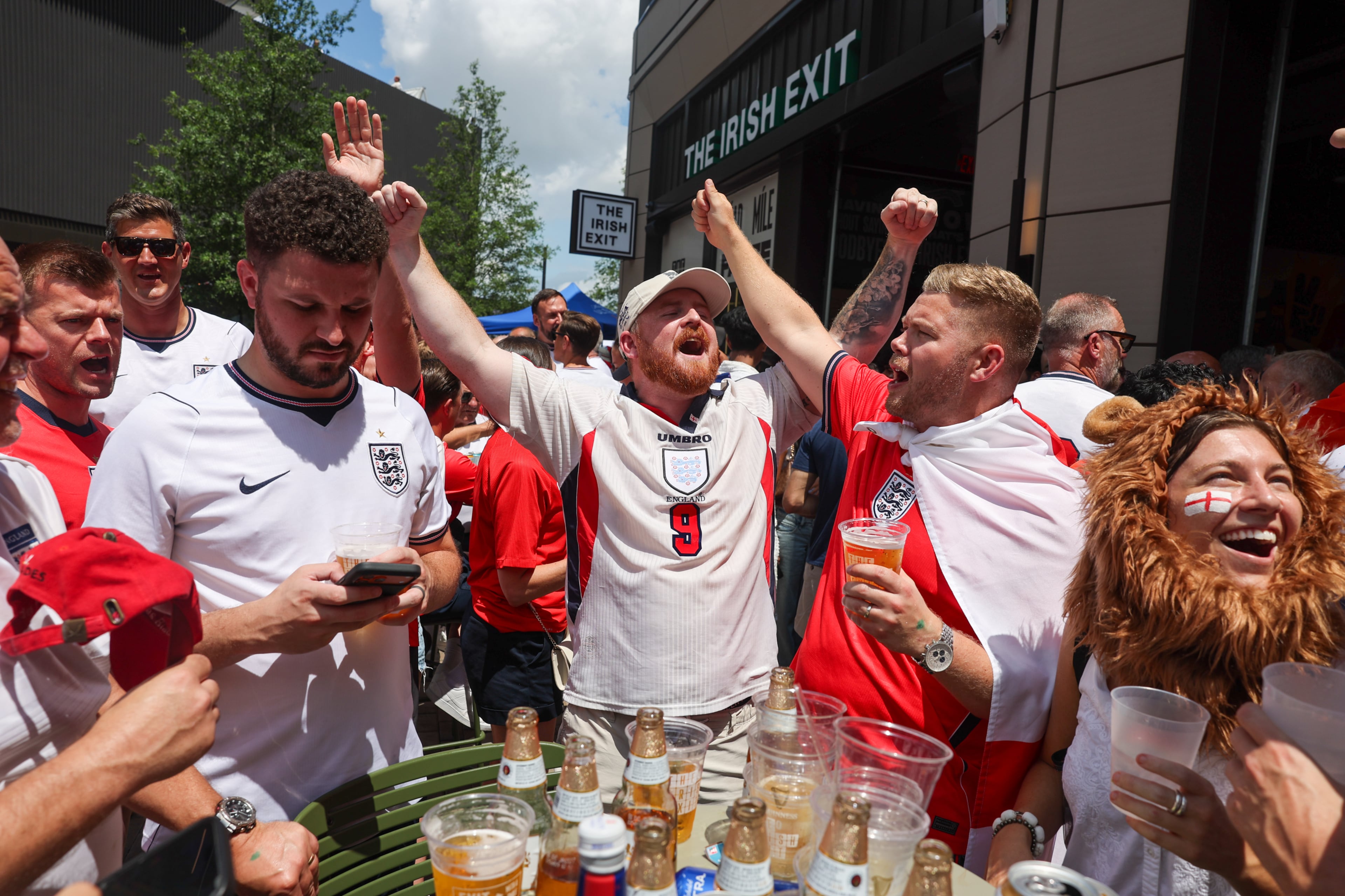 England fans celebrate at Irish Exit before the FIFA World Cup game against Argentina in Atlanta on July 15, 2026. It’s the final World Cup match Atlanta is hosting. (Arvin Temkar/AJC)