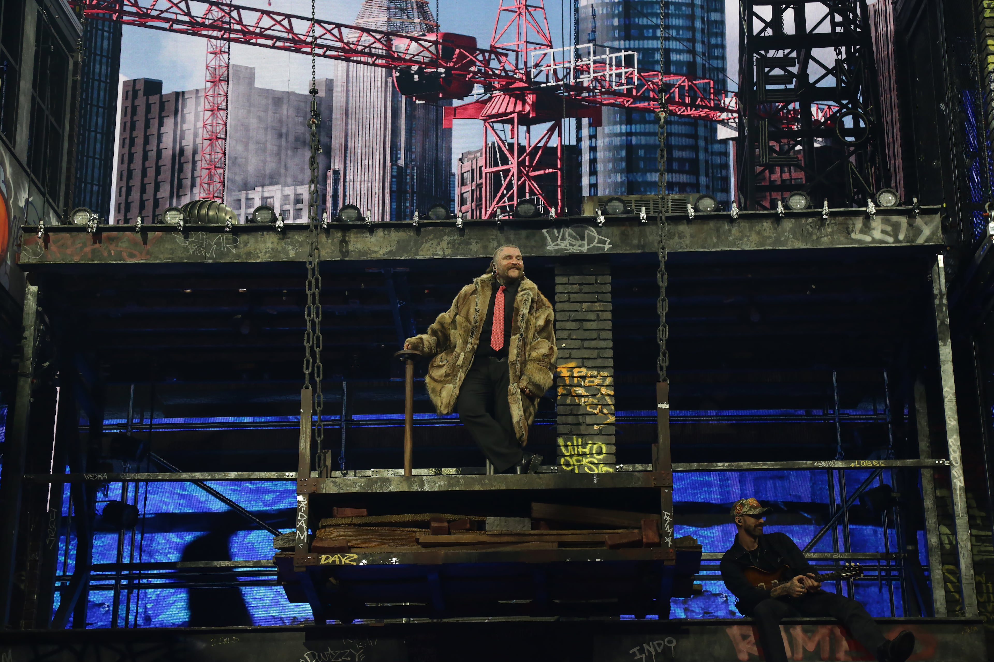 Swims greets his enthusiastic audience as he steps out onto his elaborate multi-tiered Atlanta-inspired cityscape stage at State Farm Arena, Atlanta. (Akili-Casundria Ramsess for the AJC)