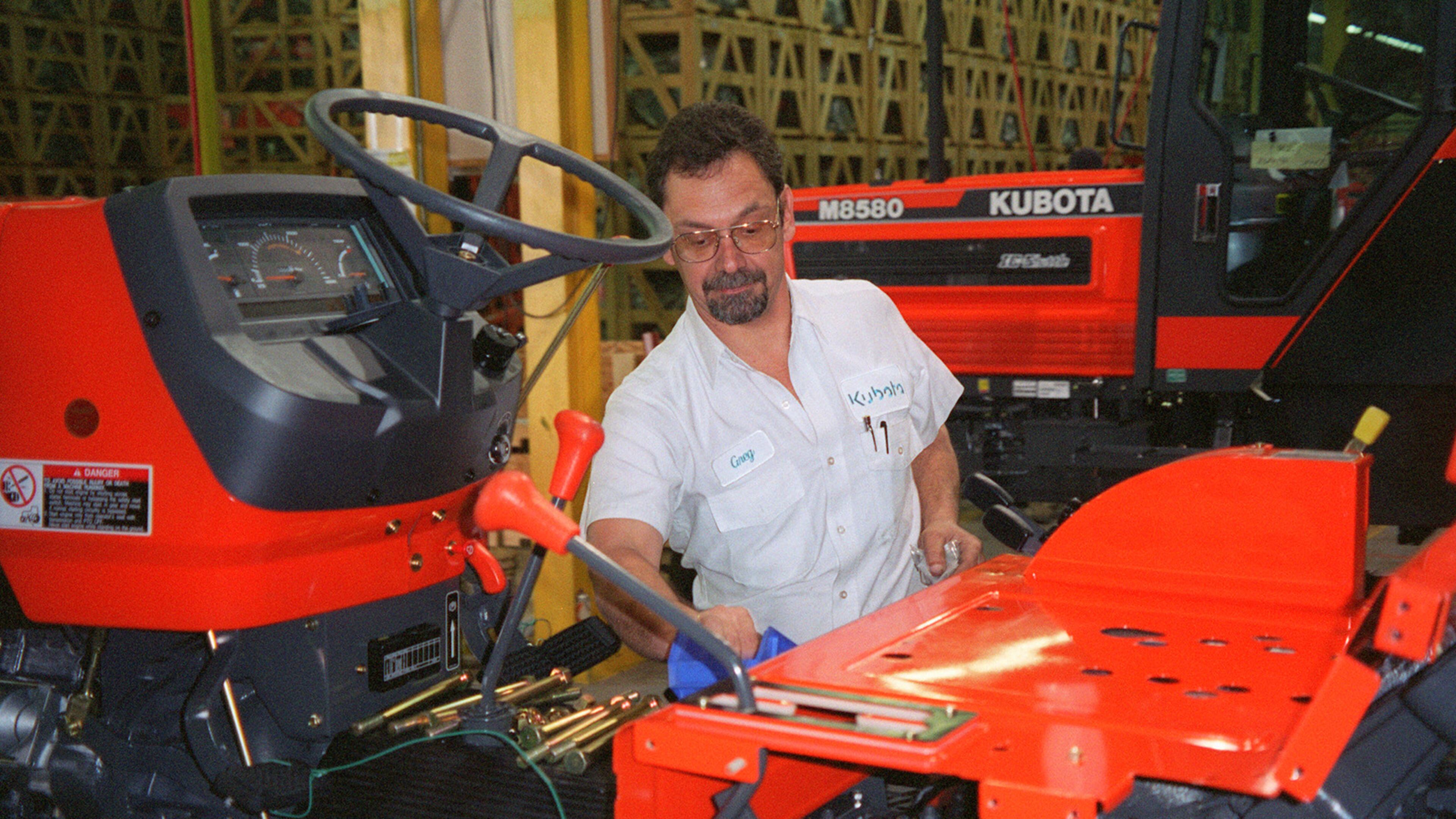 Kubota said it has begun production at its newest plant in Gainesville. In this undated photo, Kubota employee Greg Smith oversees production of a Kubota tractor in Georgia. (AJC Staff Photo/Peter Kent)