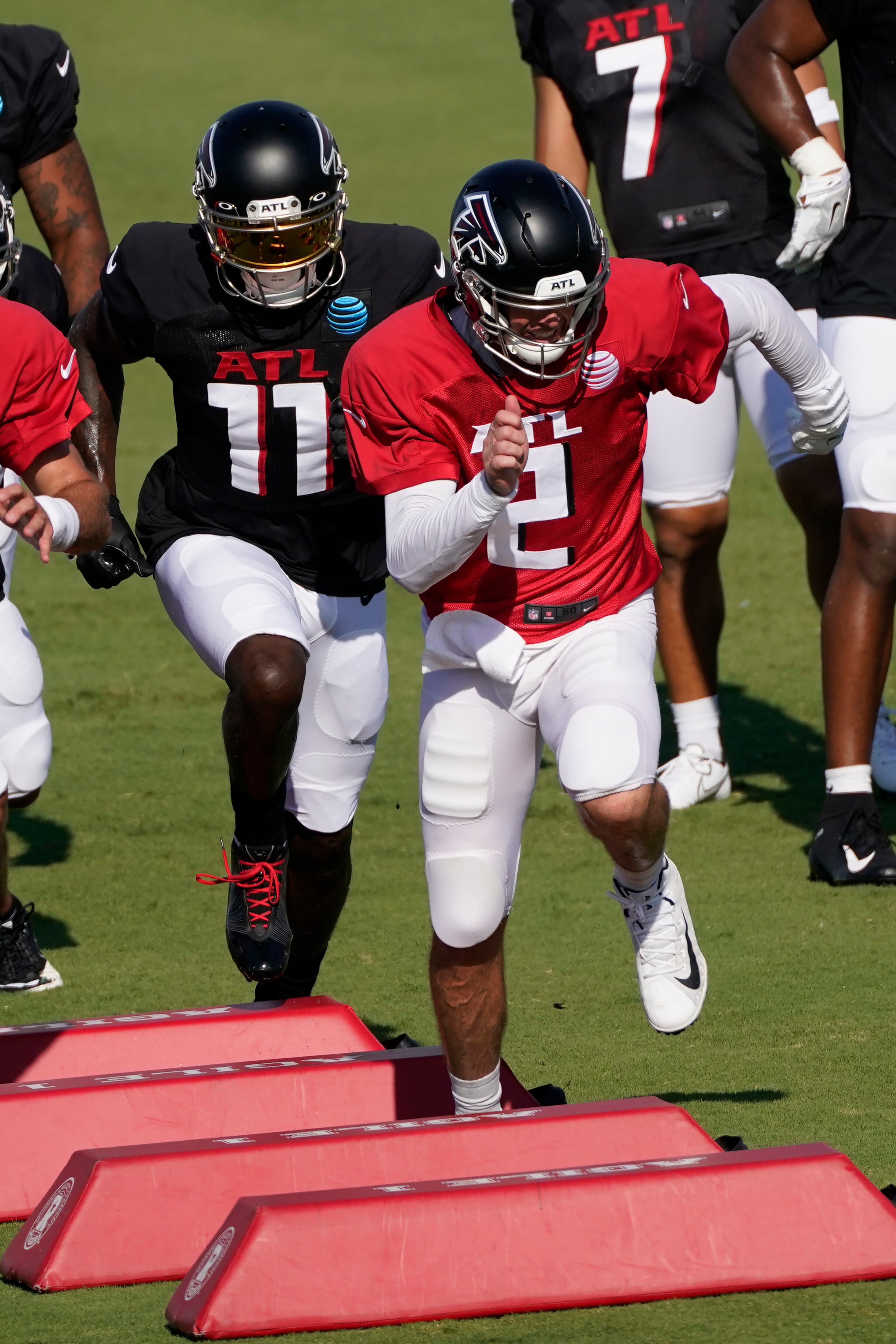 Falcons quarterback Matt Ryan (2) and receiver Julio Jones (11) run drills during Atlanta's first practice in full pads Tuesday, Aug. 18, 2020, in Flowery Branch.