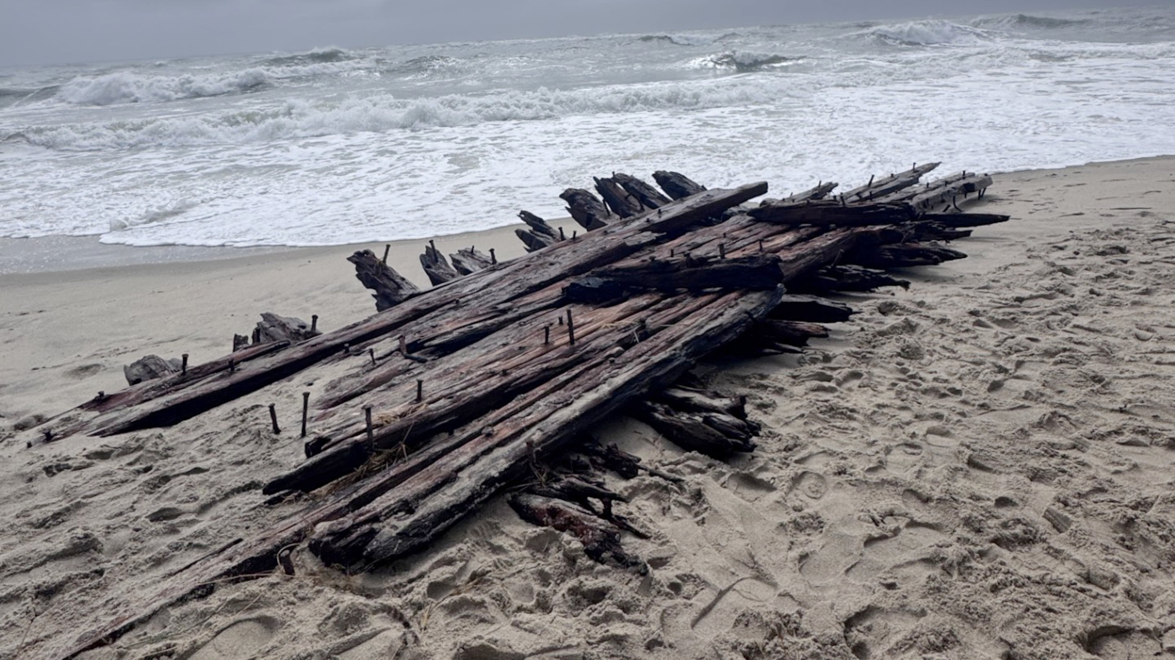 Shipwreck remains exposed by a powerful nor'easter are seen along the southern shore of Nantucket, Mass on Sunday, Sept. 27, 2026. (Hayley Nelson/Egan Maritime Institute via AP)