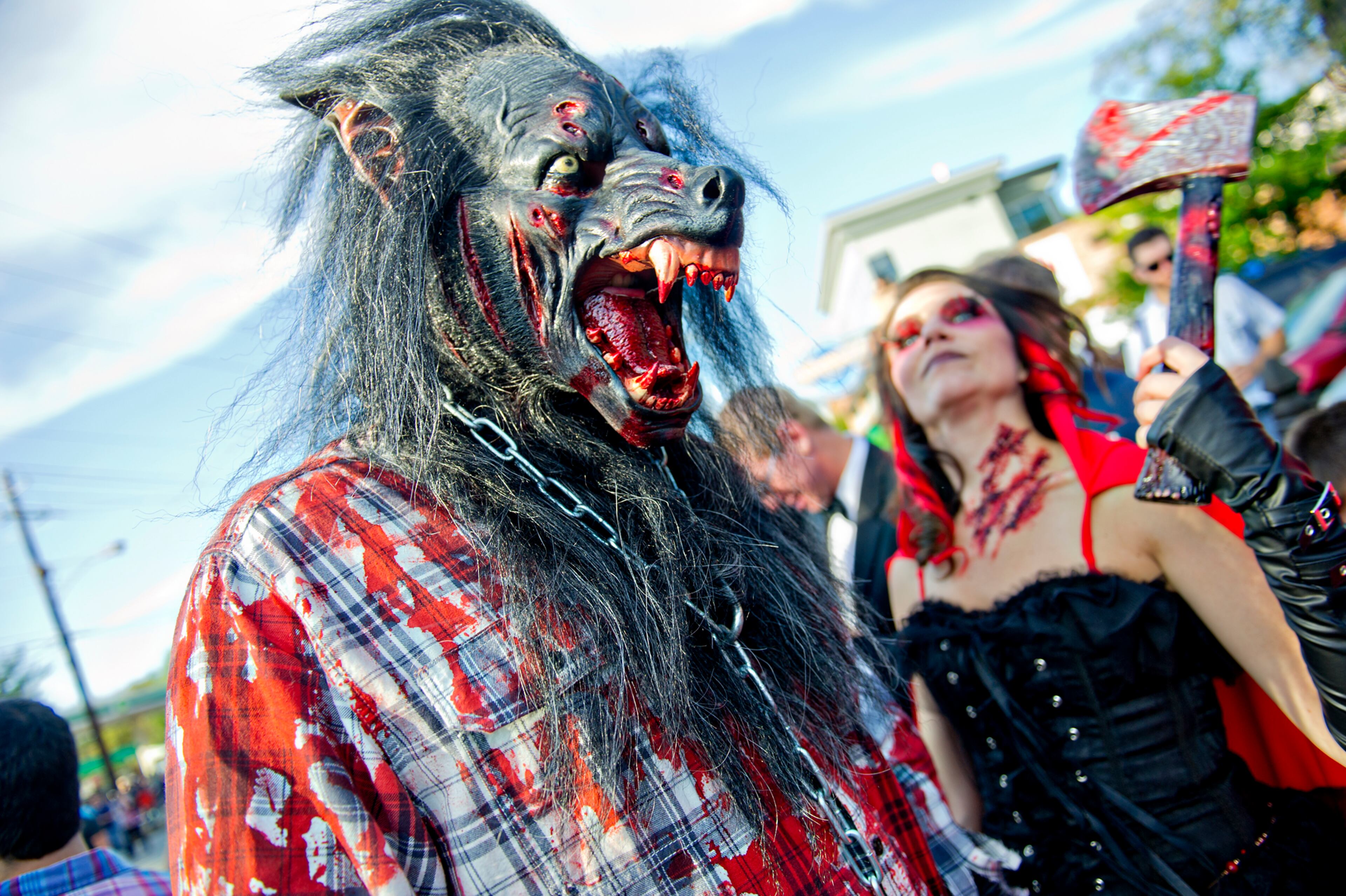 Steve Godbey (left) and Michelle Feits walk on Moreland Ave. after the end of the 14th annual Little 5 Points Halloween Parade in Atlanta on Saturday, October 18, 2014. Thousands of people lined the streets to watch the parade which featured local haunted attractions, bands and floats. JONATHAN PHILLIPS / SPECIAL