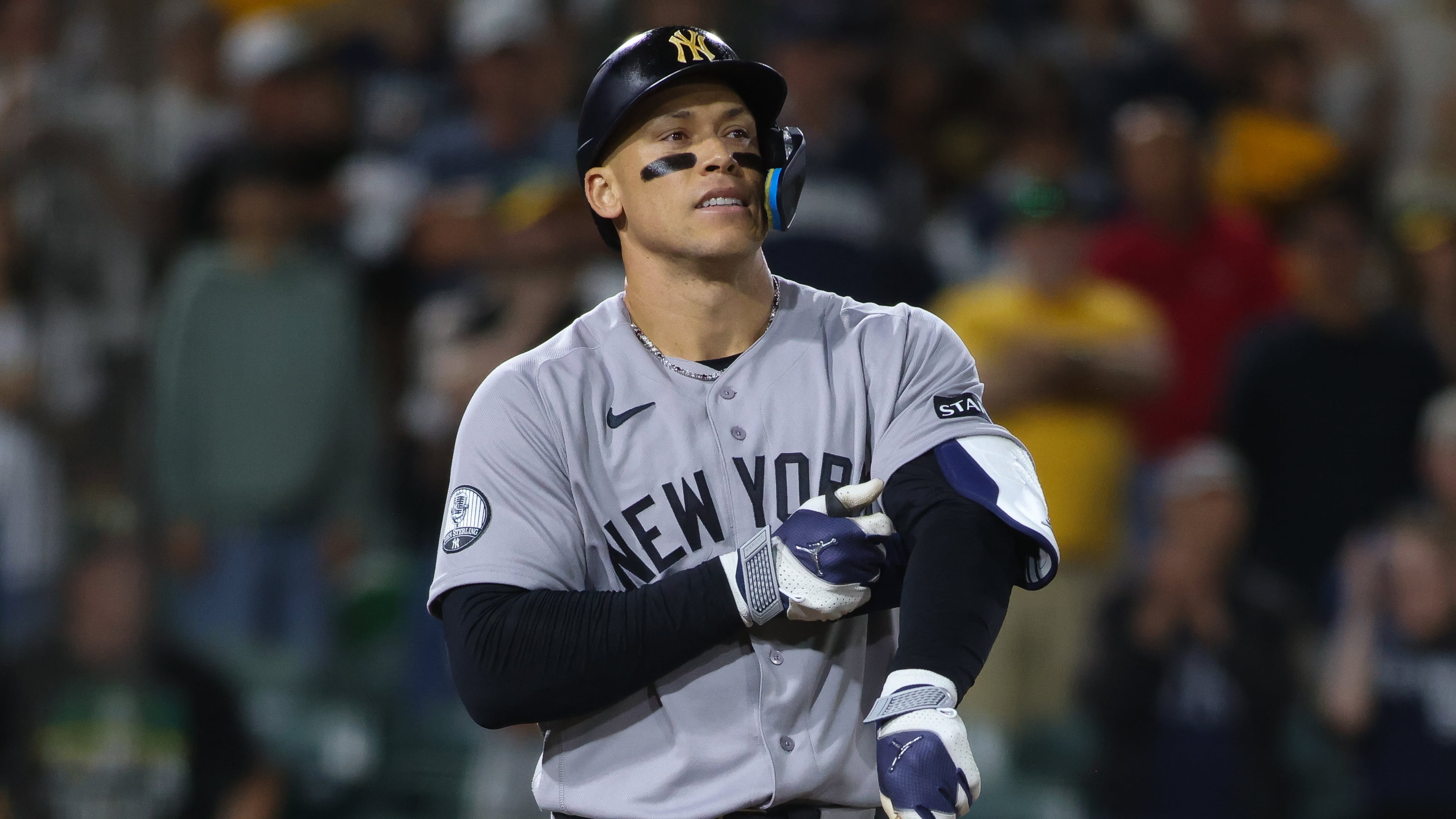 New York Yankees' Aaron Judge reacts after drawing a bases loaded walk to score a run during the ninth inning of a baseball game against the Athletics Saturday, May 30, 2026, in West Sacramento, Calif. (AP Photo/Scott Marshall)