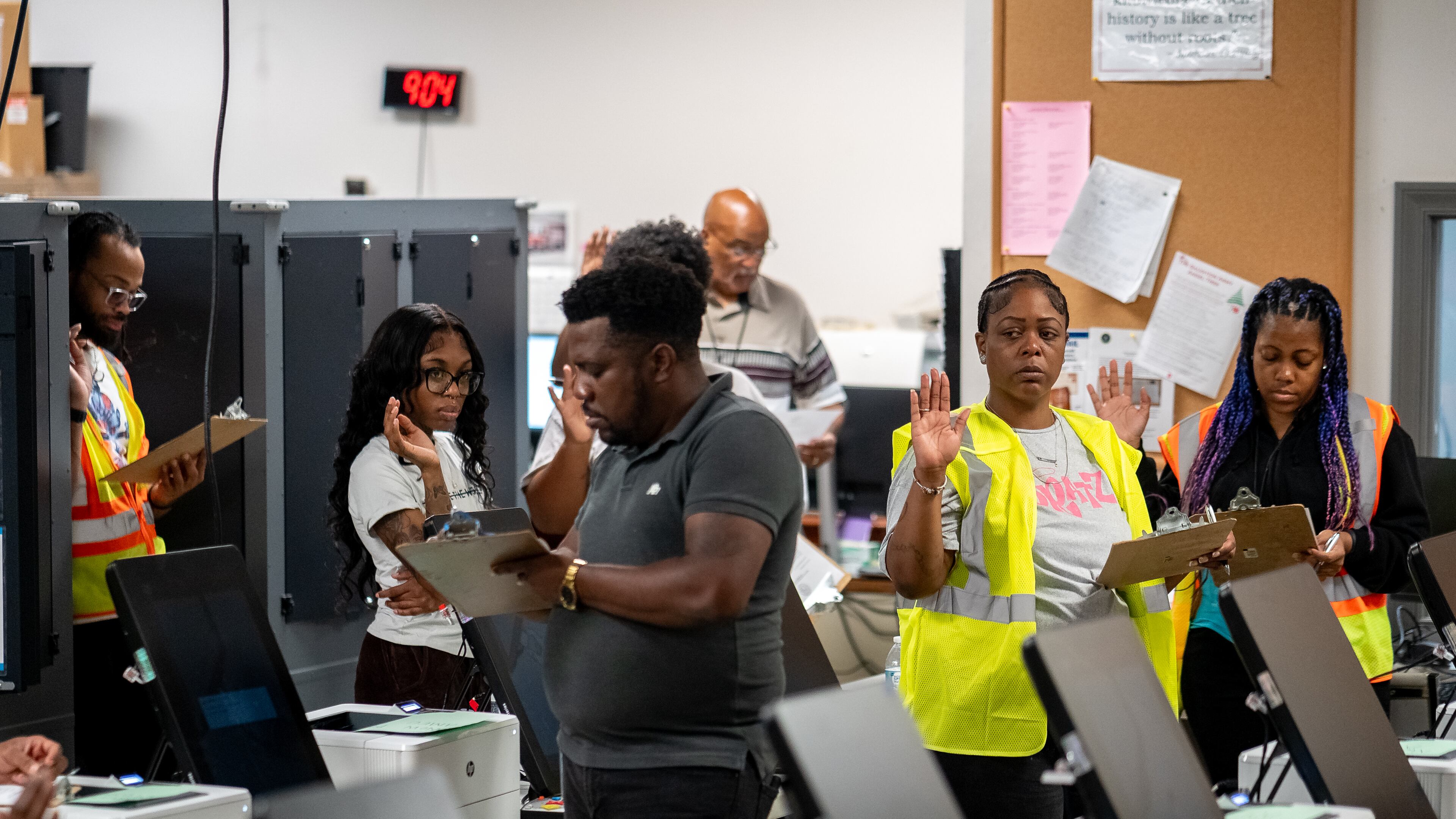 Elections employees get sworn in before beginning working. Dekalb County Elections officals conduct logic and accuracy testing of Dominion voting machines. Monday, Sept. 16, 2024 (Ben Hendren for the Atlanta Journal-Constitution)
