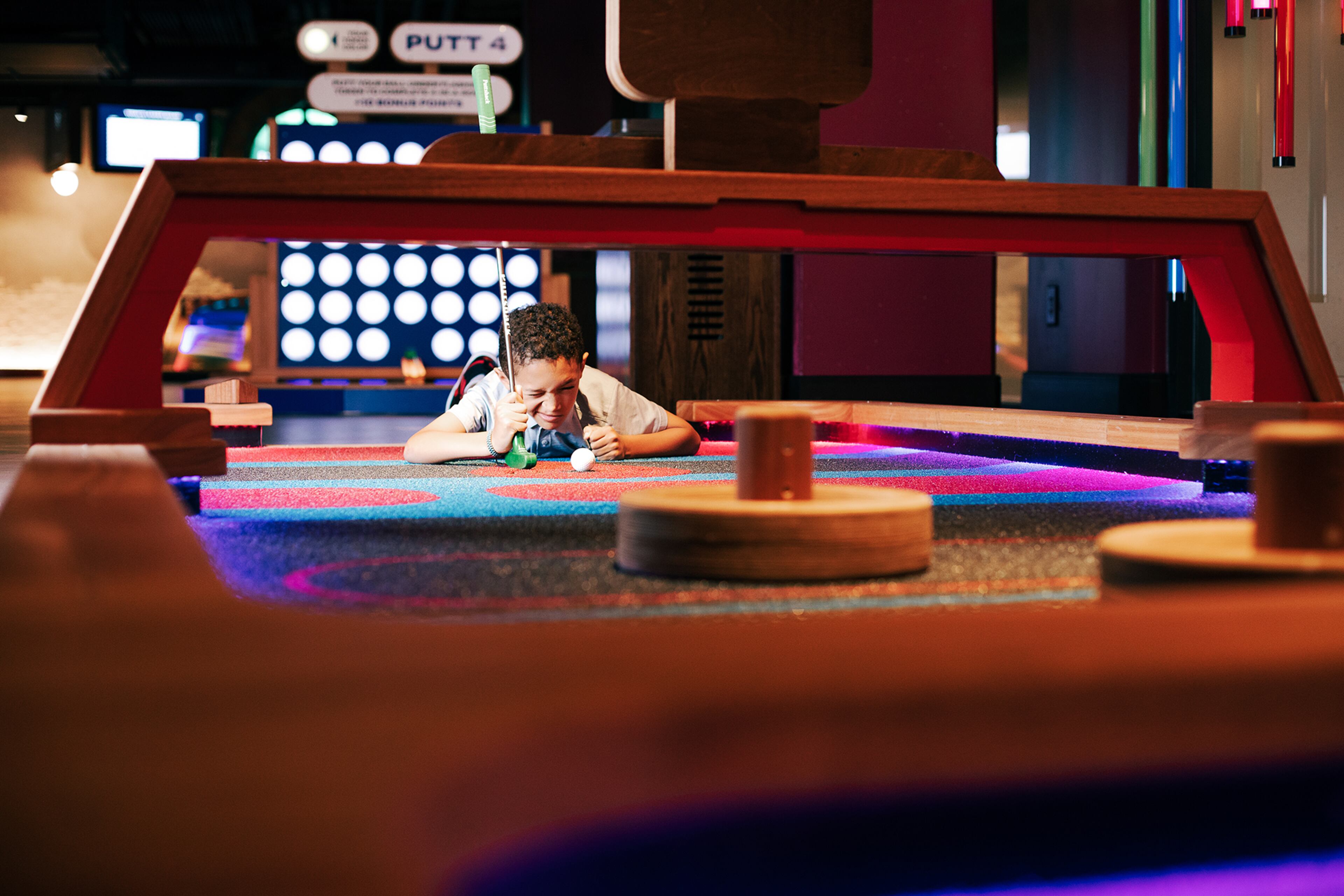A youngster lines up his putt at Puttshack -- Atlanta.
(Courtesy of Puttshack)