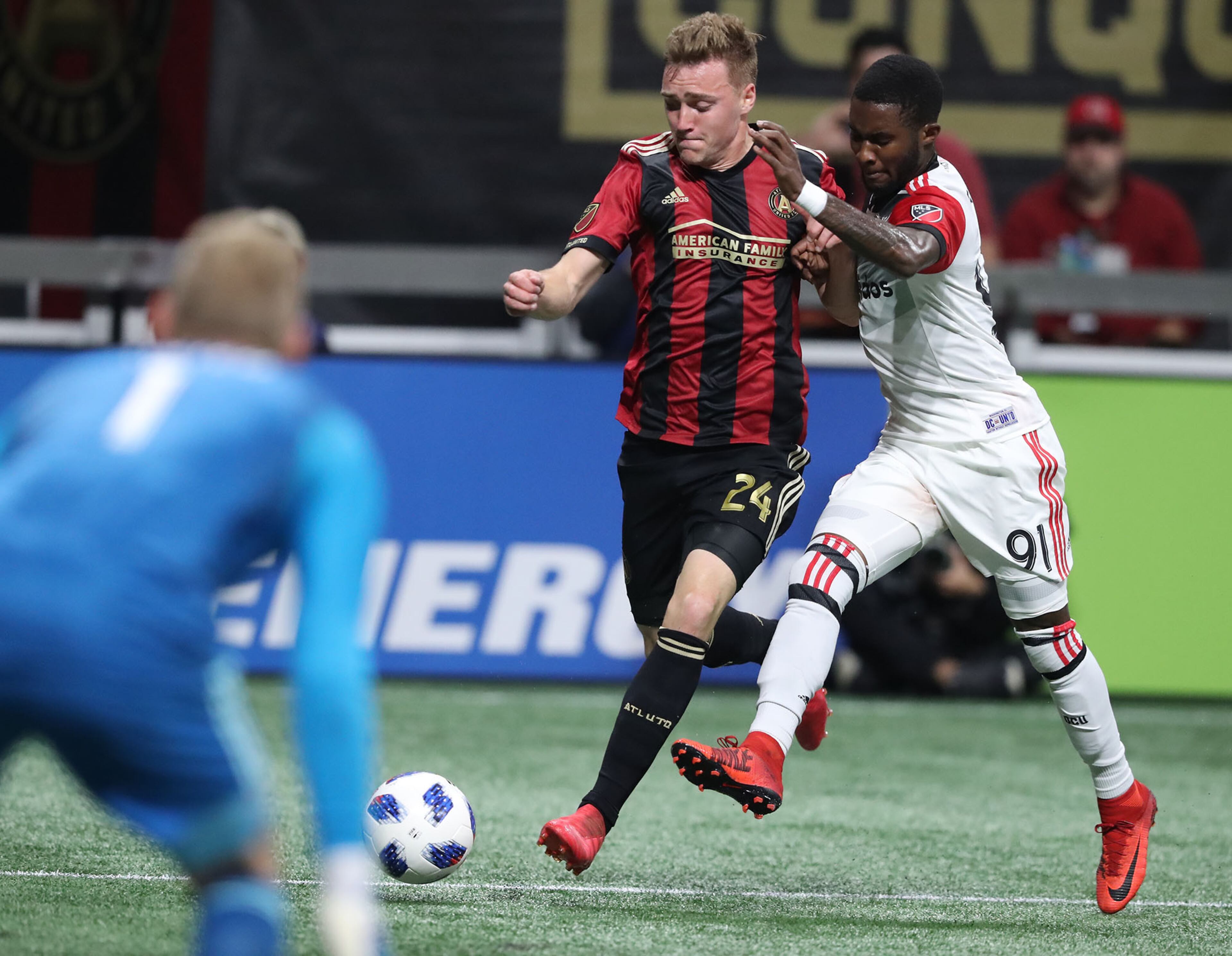 March 11, 2018 Atlanta: Atlanta United midfielder Julian Gressel battles D.C. United Oniel Fisher as he takes a shot on goal in a MLS soccer game on Sunday, March 11, 2018, in Atlanta. Curtis Compton/ccompton@ajc.com