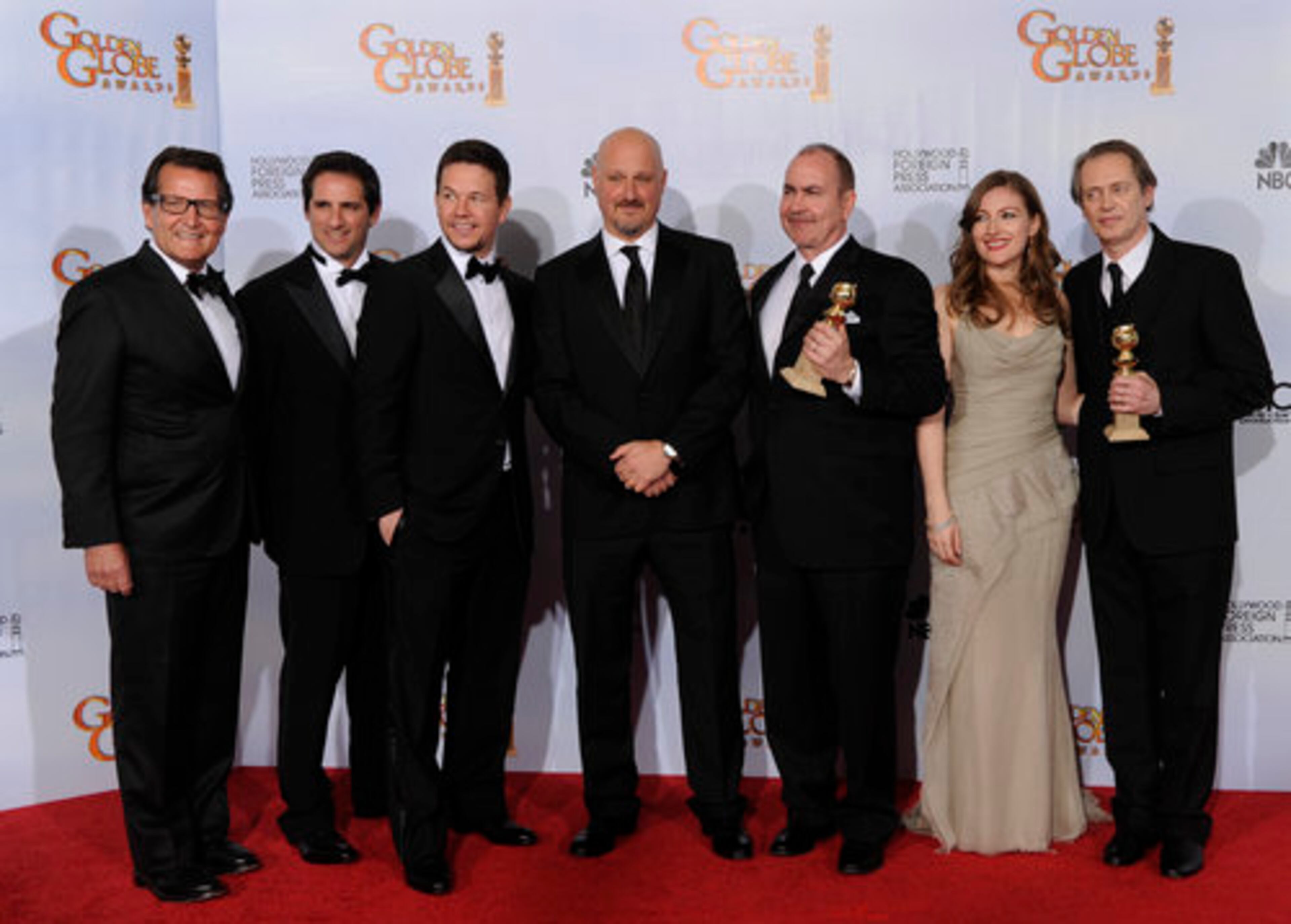 The cast and crew of the show "Boardwalk Empire," pose backstage with the award they won for Best Television Series - Drama at the Golden Globe Awards Sunday, Jan. 16, 2011, in Beverly Hills, Calif.