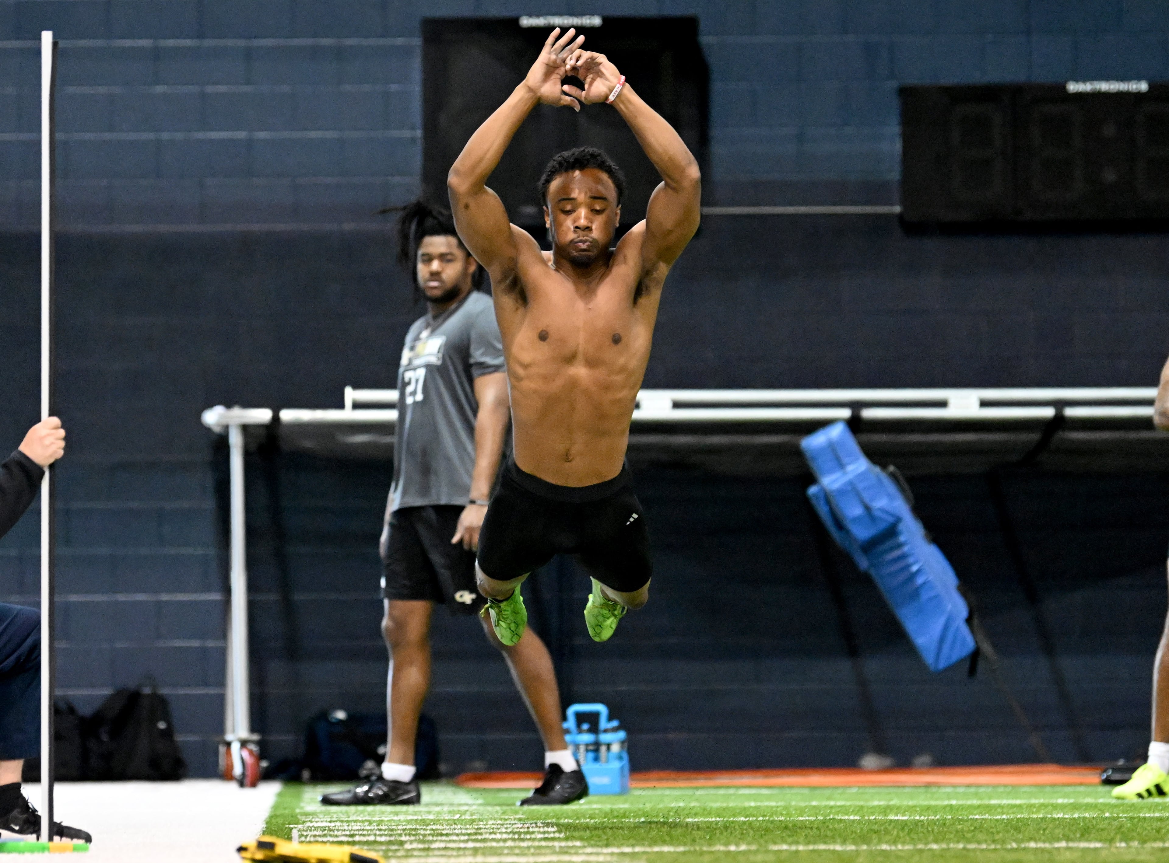 Georgia Tech wide receiver Chase Lane (7) attempts the broad jump during Georgia Tech Pro Day at Rose Bowl Field and the Mary and John Brock Football Practice Facility, Friday, March 14, 2025, in Atlanta. (Hyosub Shin / AJC)