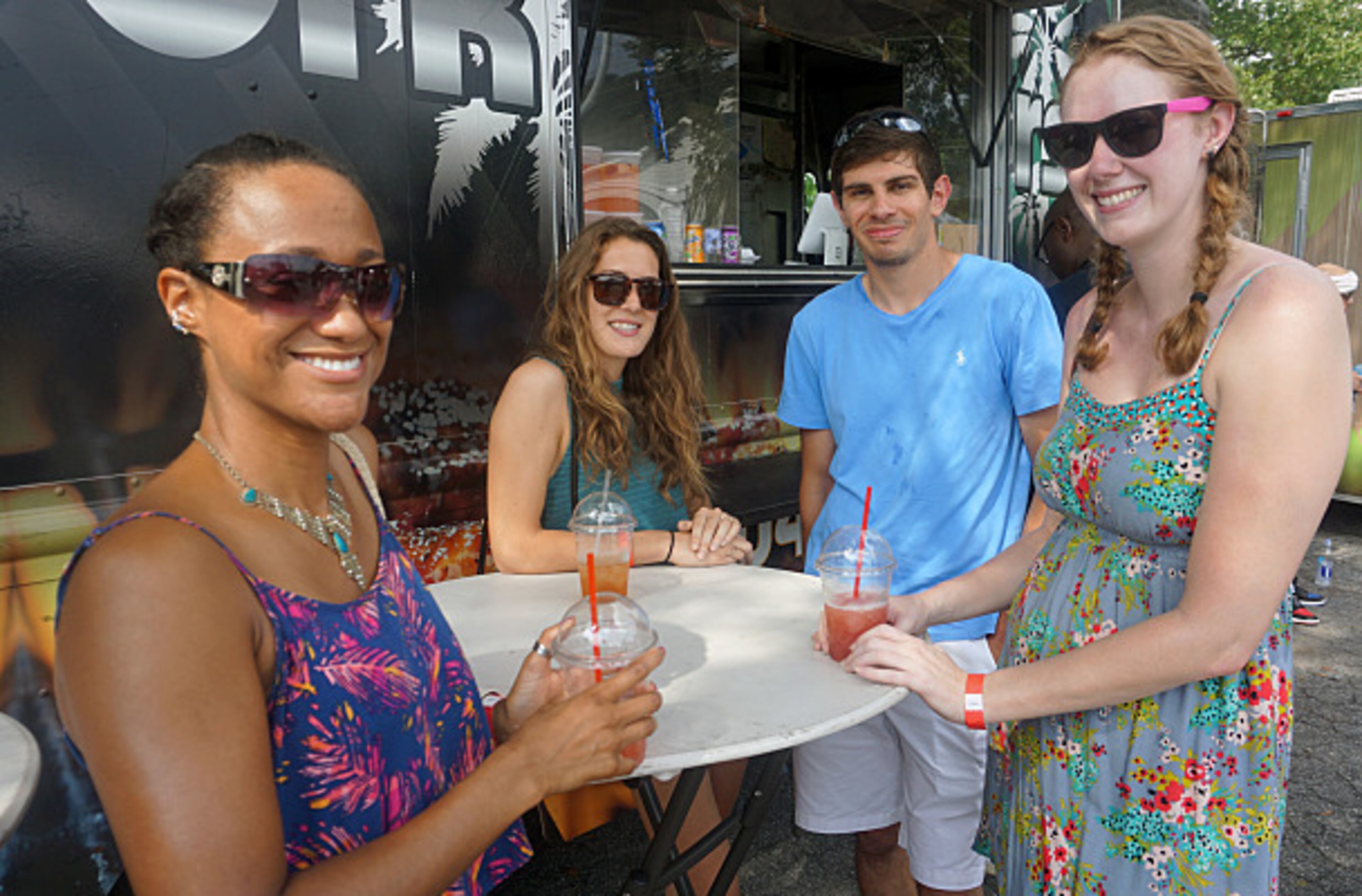 Tracy Cunningham (left), Julia Vaillancourt, Bogdan Gadidov and Marley Pruyn smile for the camera at the first black-owned Atlanta Food Truck Park.