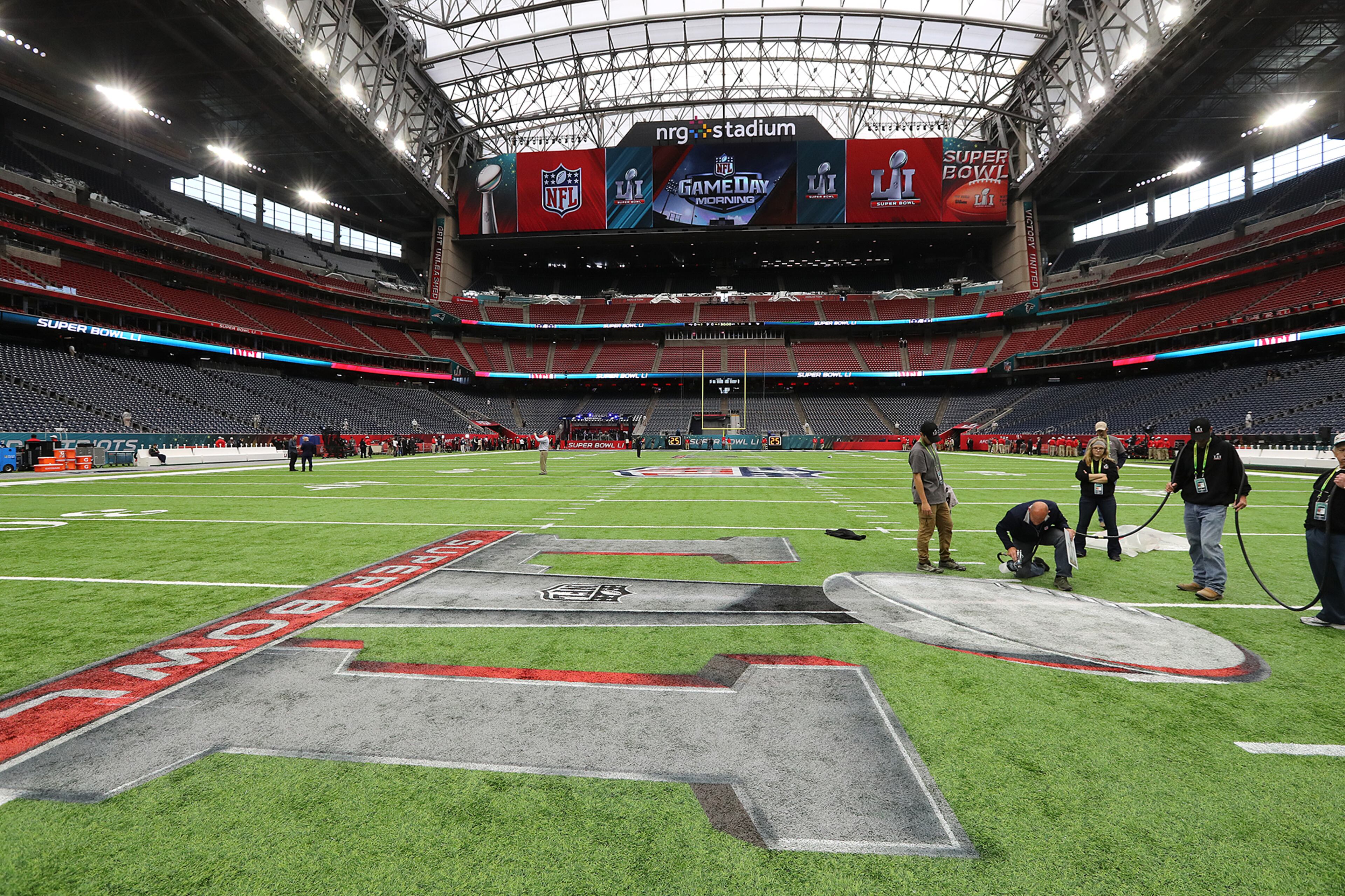 February 5, 2017, Houston: Ed Mangan, Atlanta, puts the finishing touch on the field for the start of the Super Bowl in NRG Stadium on Sunday Feb. 5, 2017, in Houston.
