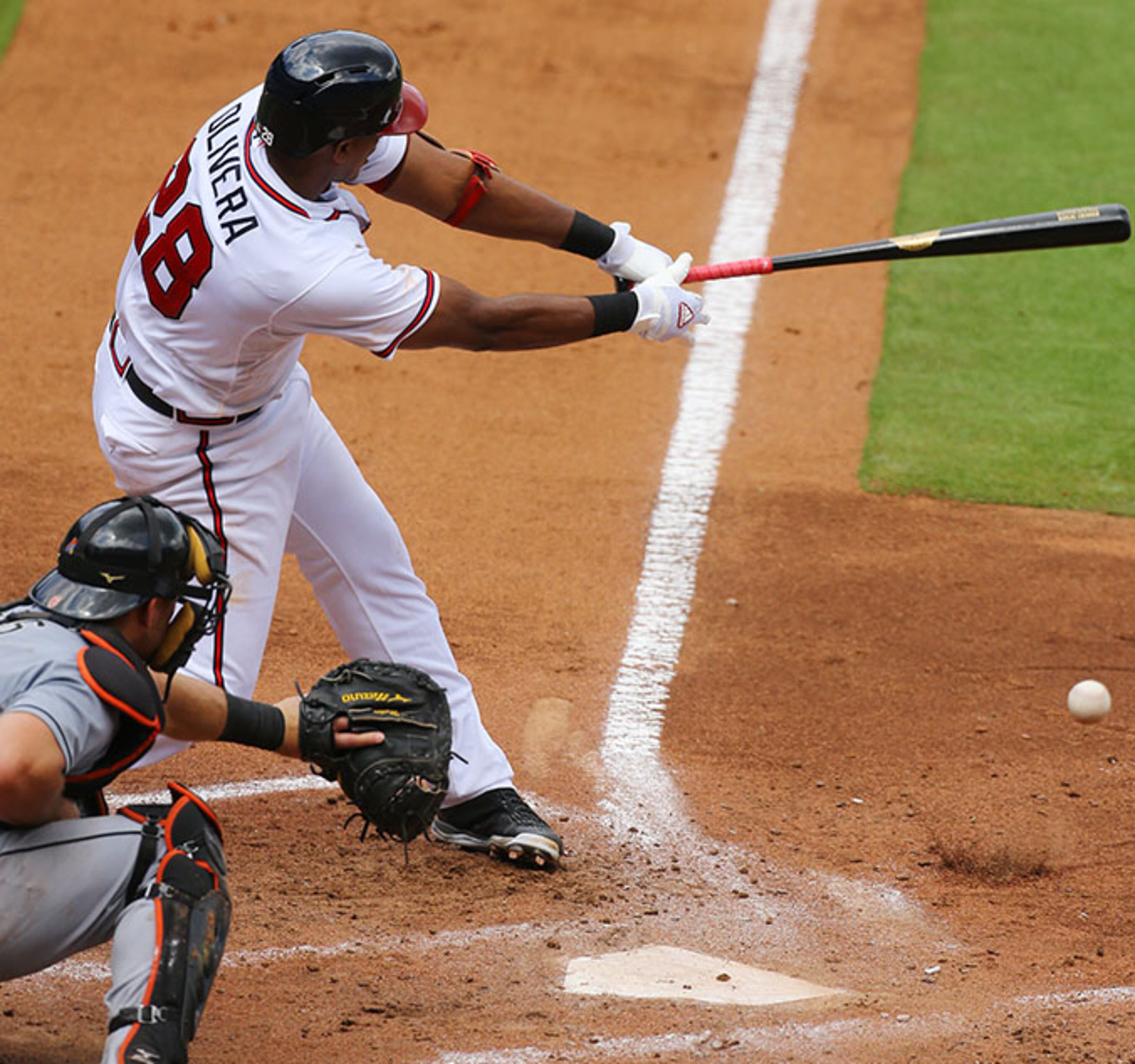 Braves third baseman Hector Olivera gets his first major league hit, an RBI single bouncing off the dirt to score Freddie Freeman during the third inning against the Marlins Wednesday, Sept. 2, 2015, in Atlanta.