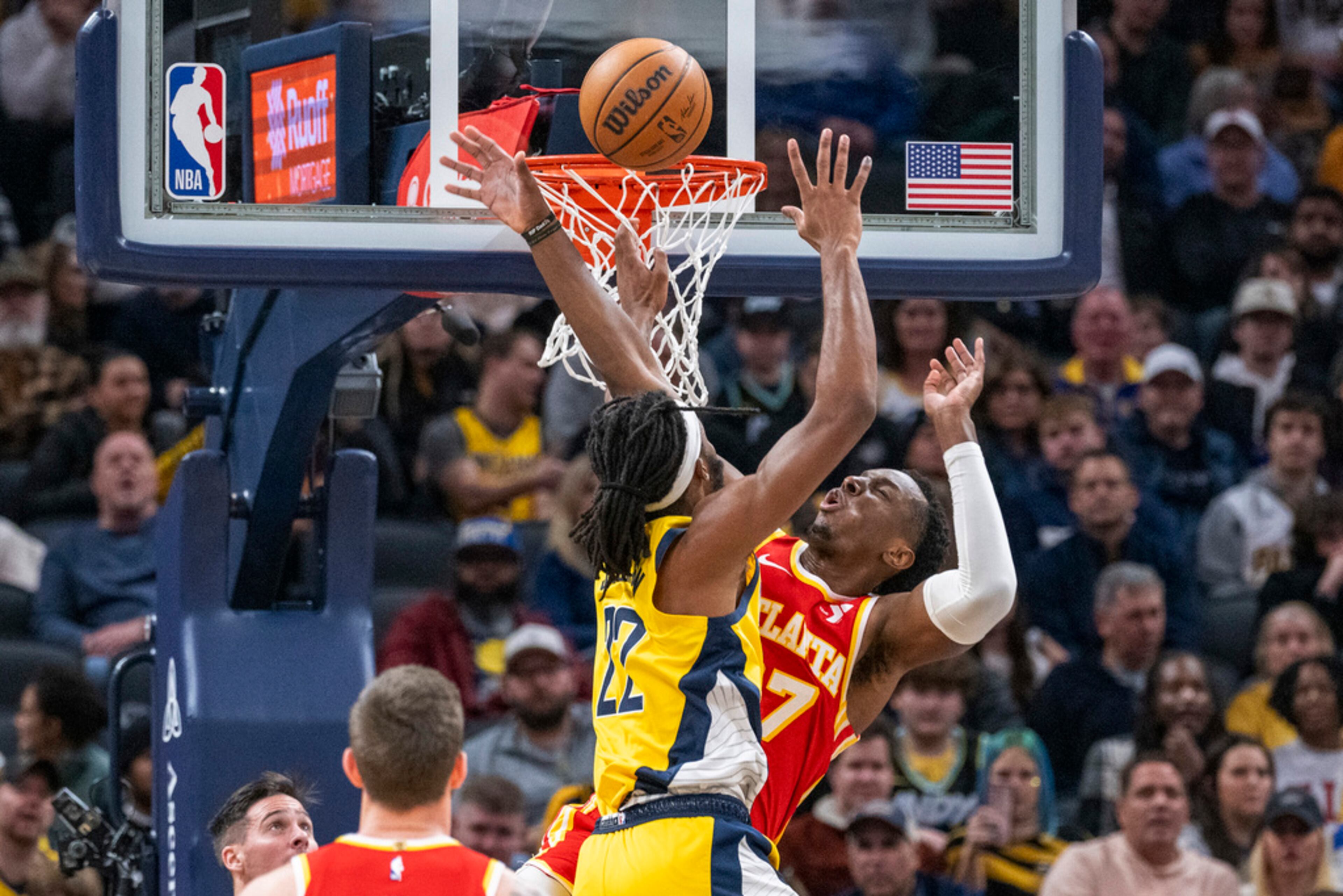 A shot by Indiana Pacers forward Isaiah Jackson, top left, is blocked by Atlanta Hawks forward Onyeka Okongwu during the first half of an NBA basketball game in Indianapolis, Friday, Jan. 5, 2024. (AP Photo/Doug McSchooler)