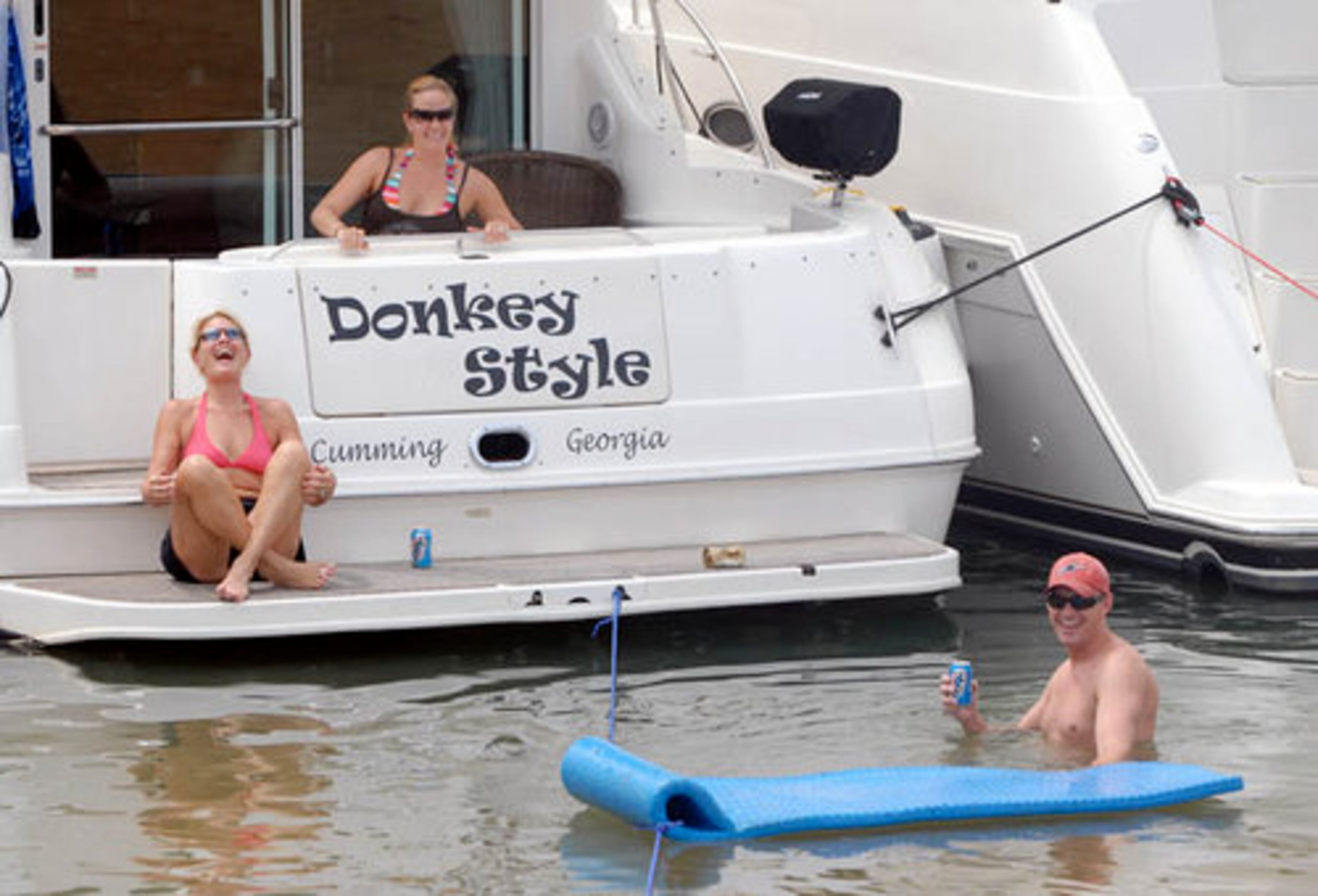 Karen Armstrong, of Atlanta, and Melissa and Jeremy Gentry, of Cumming, share a laugh.