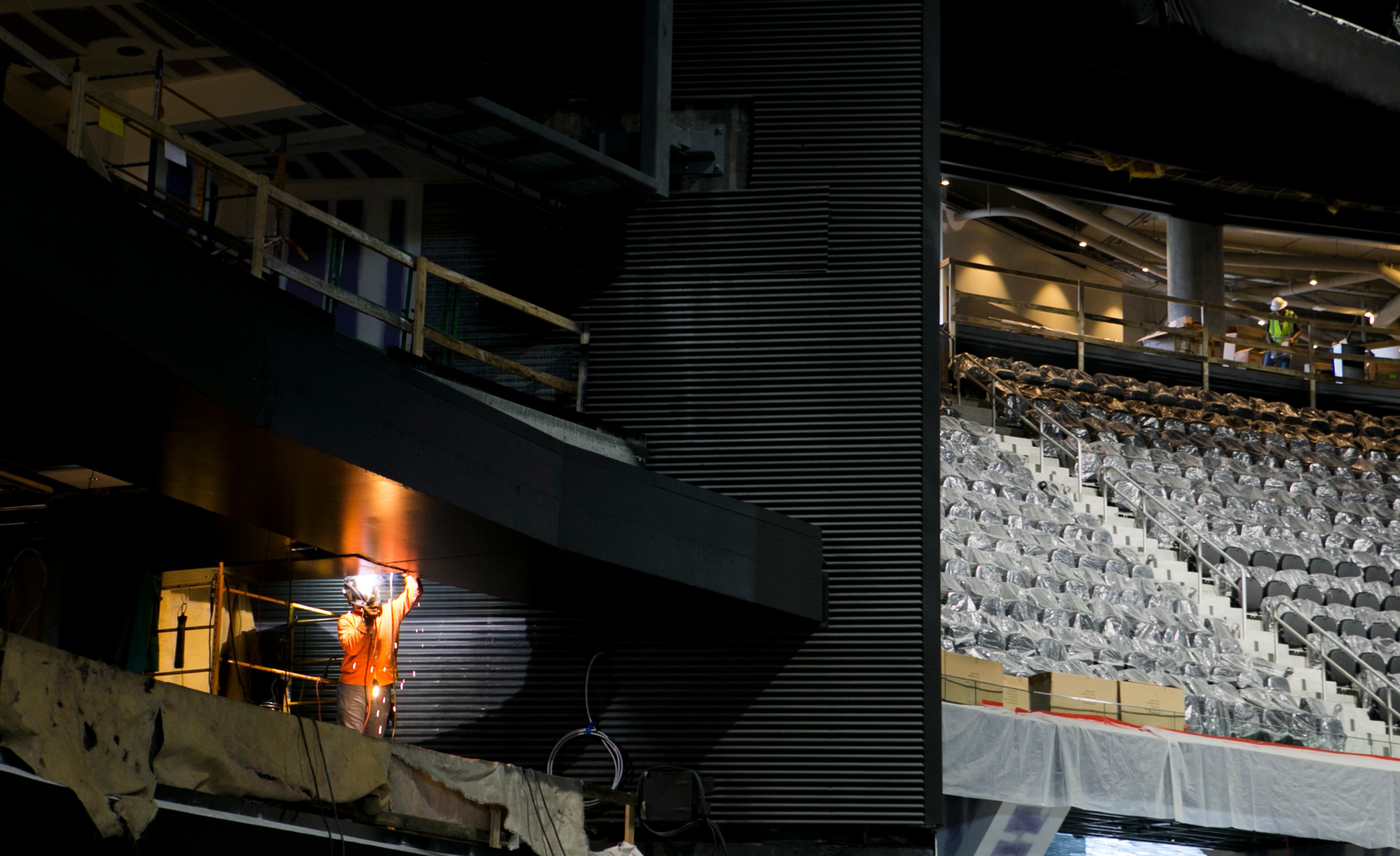 A construction worker welds in the main ballroom during a guided media tour through the in-progress renovations at the State Farm Arena in Atlanta, Ga., on Thurs., Sept. 20, 2018. The renovations, which total $192.5 million, are on track to be completed by the arena's scheduled open house on October 20. The current rate of progress is about $1 million of work per day, according to Brett Stefansson, Atlanta Hawks executive vice president and general manager of State Farm Arena. (CASEY SYKES, CASEYLANESYKES@GMAIL.COM)