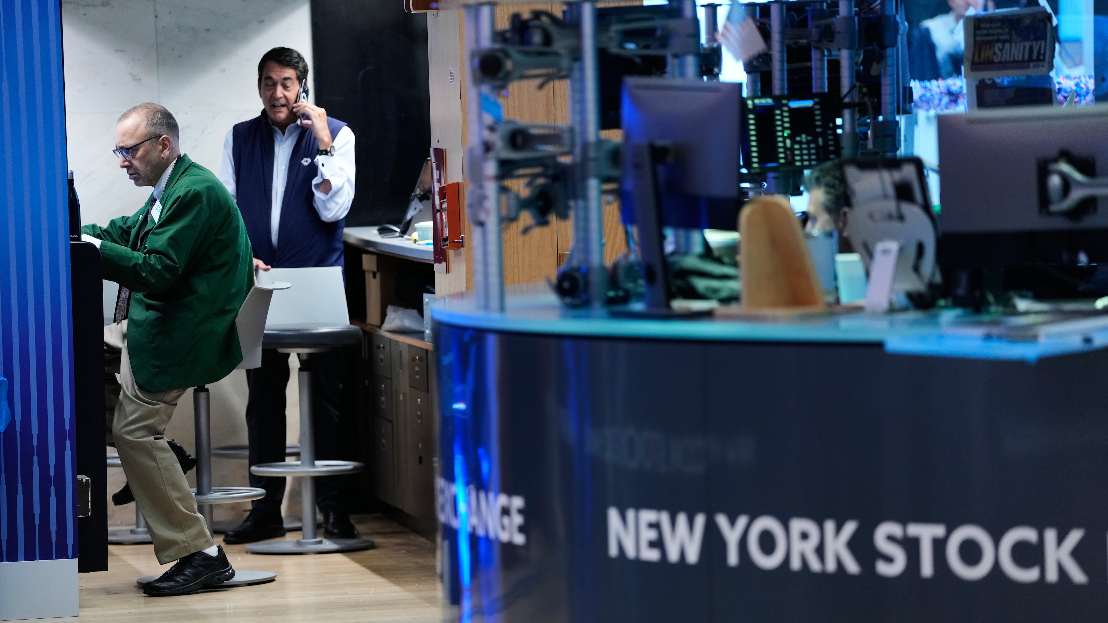 Traders work on the floor at the New York Stock Exchange in New York, Monday, July 6, 2026. (AP Photo/Seth Wenig)