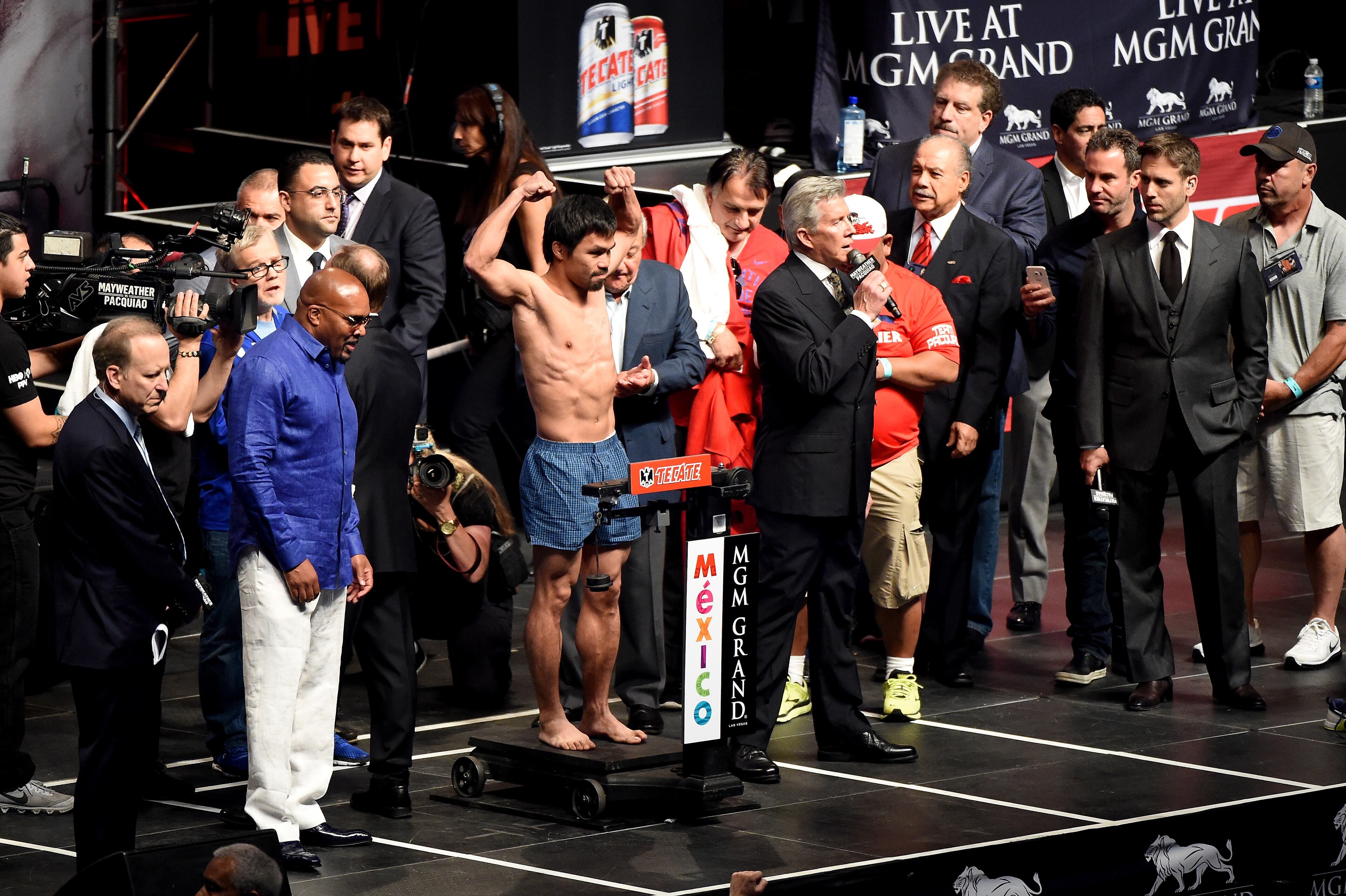LAS VEGAS, NV - MAY 01: Manny Pacquiao poses on the scale during his official weigh-in on May 1, 2015 at MGM Grand Garden Arena in Las Vegas, Nevada. Pacquiao will face Floyd Mayweather Jr. in a welterweight unification bout on May 2, 2015 in Las Vegas. (Photo by Harry How/Getty Images)