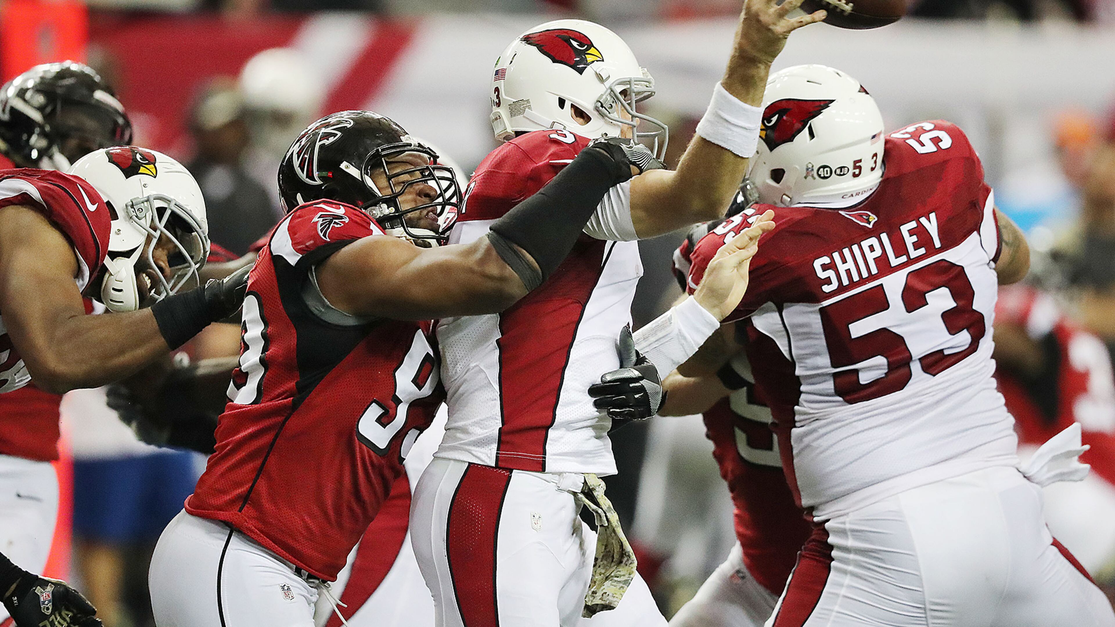 Falcons defensive end Dwight Freeney hits Arizona quarterback Carson Palmer to force an incomplete pass during the fourth quarter of a game on Nov. 27. It was the Falcons’ first game after the bye, which allowed Freeney a chance to rest a torn quad. (Curtis Compton/ccompton@ajc.com)