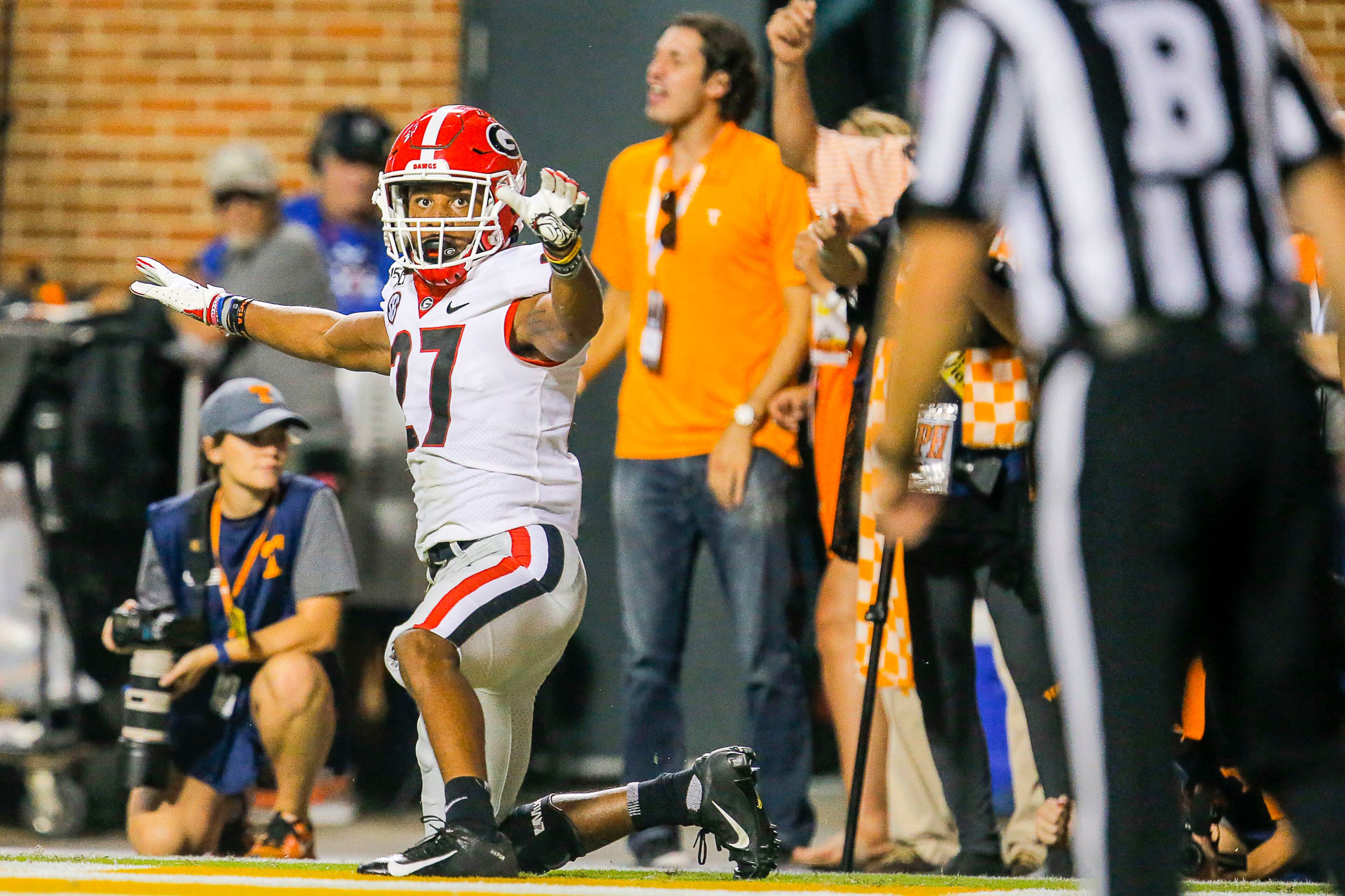 Georgia Bulldogs defensive back Eric Stokes (27) signals an incomplete pass after defending the ball against Tennessee Volunteers wide receiver Marquez Callaway. (Alyssa Pointer/Atlanta Journal Constitution)