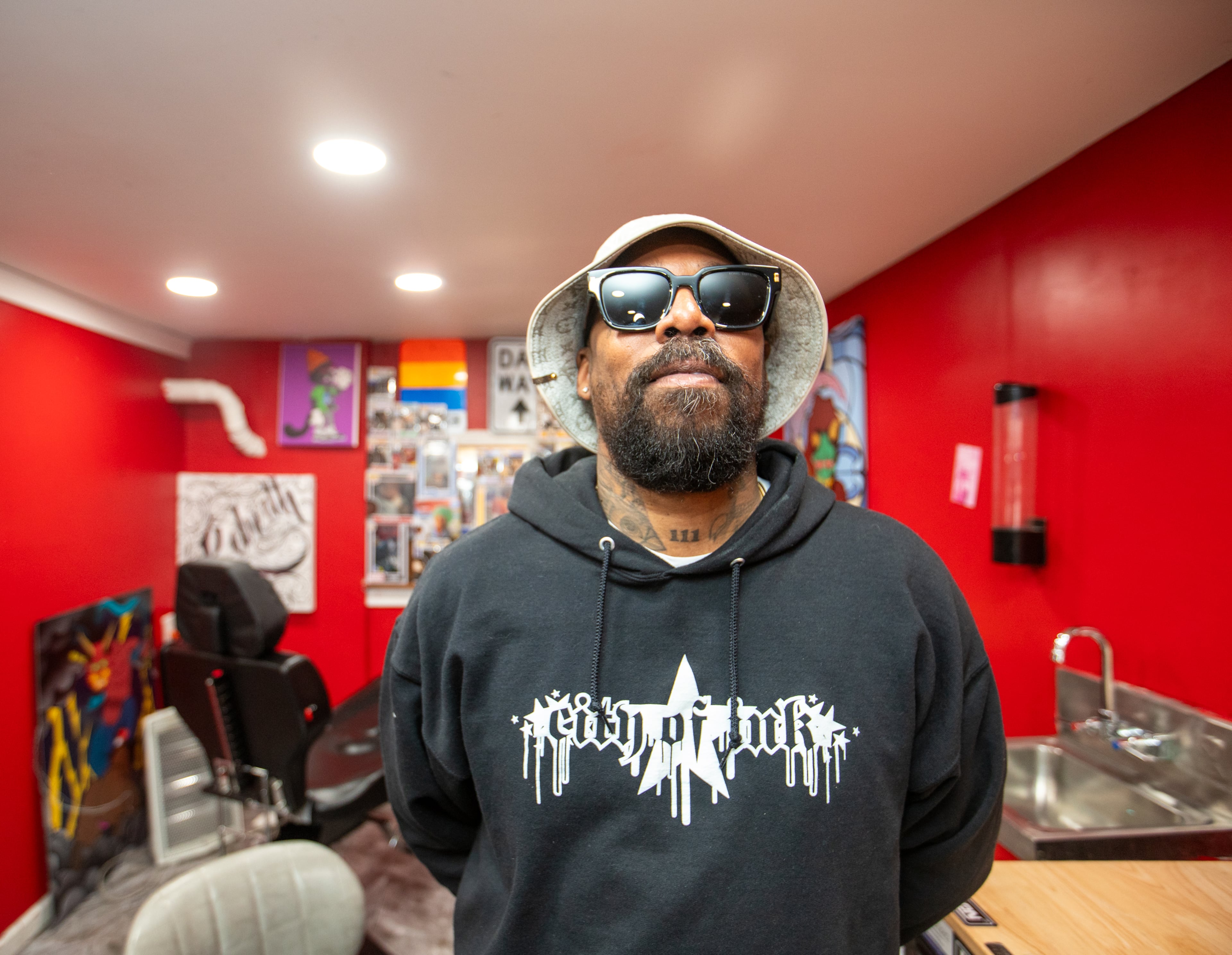 Miya Bailey is at City of Ink on Walker Street on Wednesday, Feb 21, 2024 where he started his career as a tattoo artist.. Bailey, who also owns Peters Street Station, a community center and coffee shop with a back room art gallery, is the entrepreneur, tattoo artist and property owner who continues to be a creative inspiration for the community. (Jenni Girtman for The Atlanta Journal-Constitution)