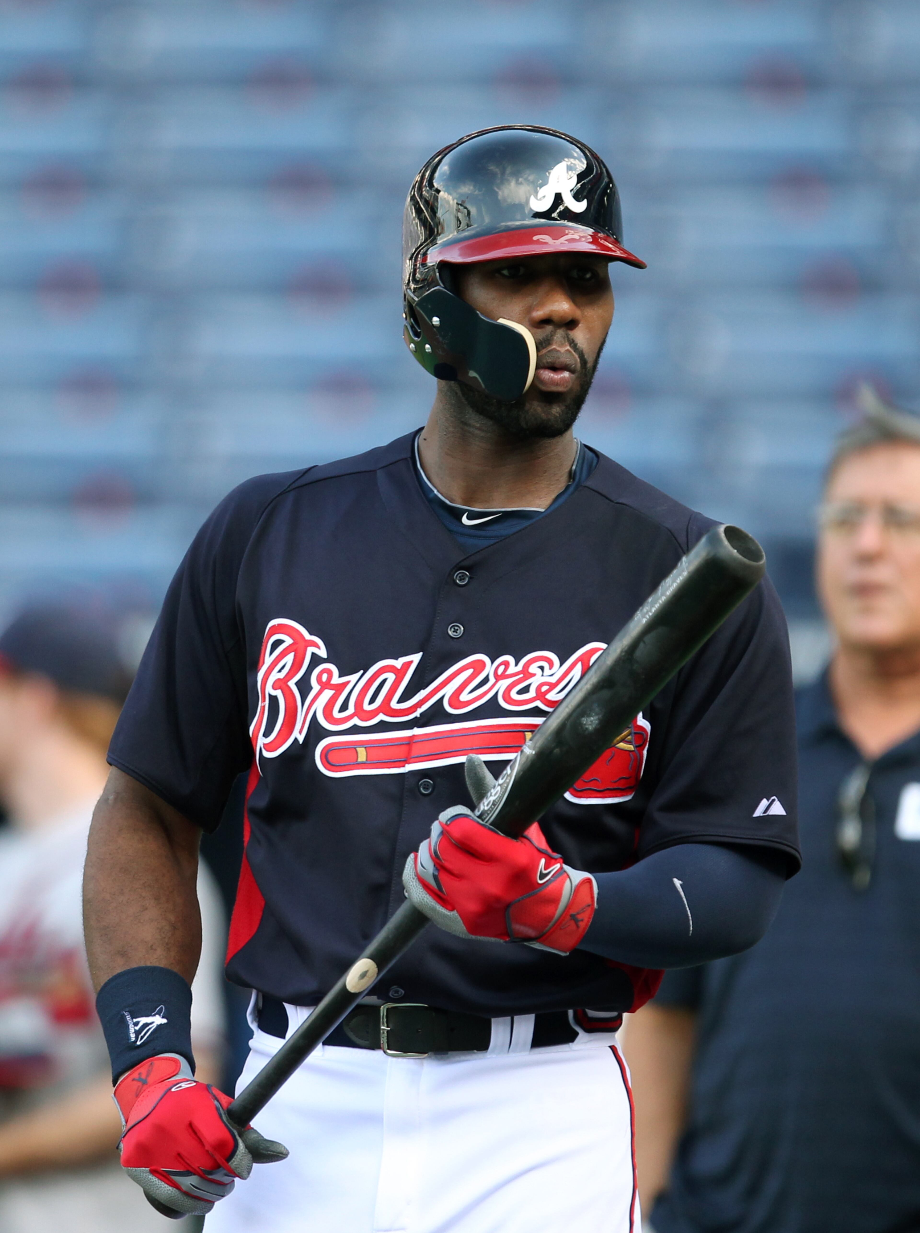 Atlanta Braves outfielder Jason Heyward wears a batting helmet with a protective shield as he prepares himself for some batting practice before the Braves host the San Diego Padres at Turner Field Friday night in Atlanta, Ga., September 13, 2013. On August 21, 2013, Heyward was struck in the right jaw by a fastball from New York Mets pitcher Jonathon Niese. The injury required a surgery inserting two plates to stabilize the two fractures in his jaw.