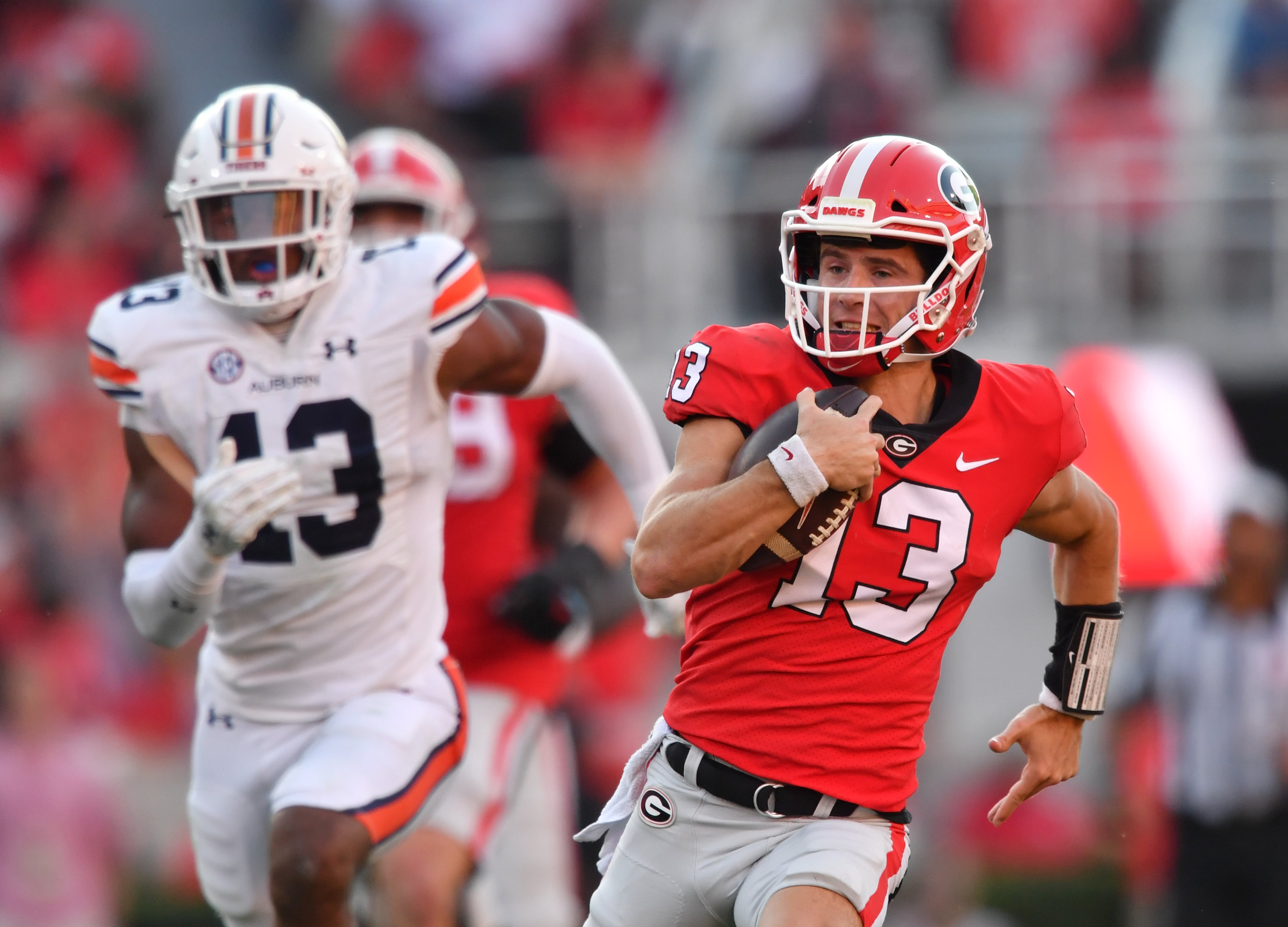 Georgia's quarterback Stetson Bennett (13) runs for a touchdown during the second half in a NCAA college football game at Sanford Stadium in Athens on Saturday, October 8, 2022. Georgia won 42-10 over Auburn. (Hyosub Shin / Hyosub.Shin@ajc.com)