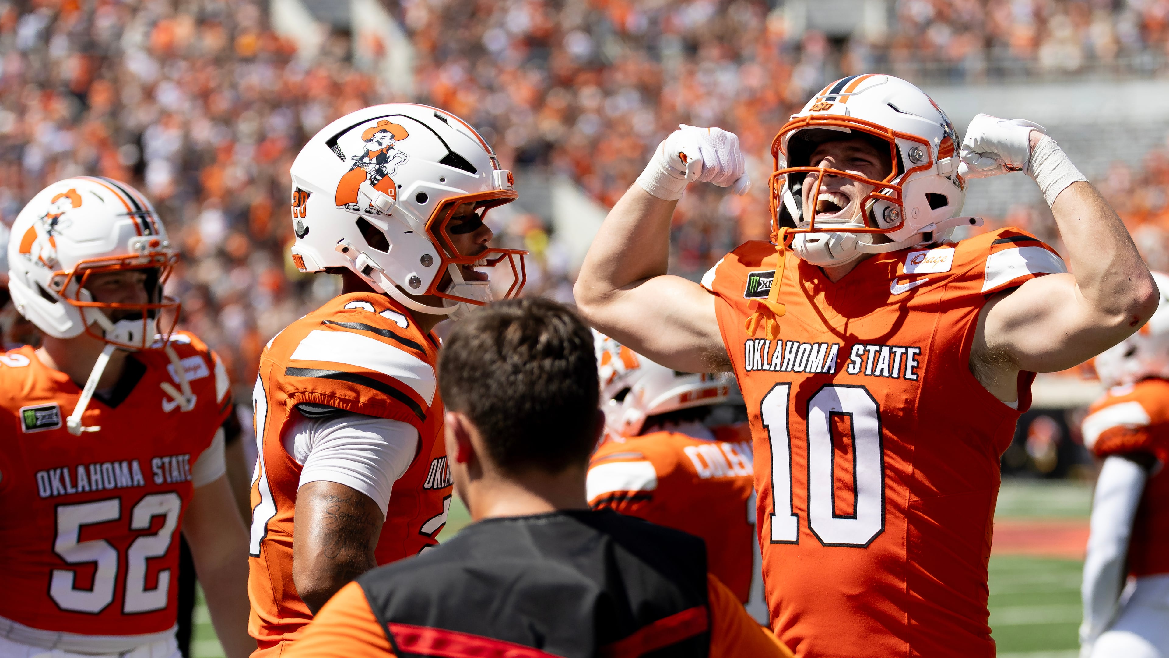 Oklahoma State wide receiver Wyatt Young (10) celebrates towards the fans after scoring a touchdown in the first half of the NCAA college football game against Oregon in Stillwater, Okla., Saturday, Sept. 12, 2026. (AP Photo/Mitch Alcala)