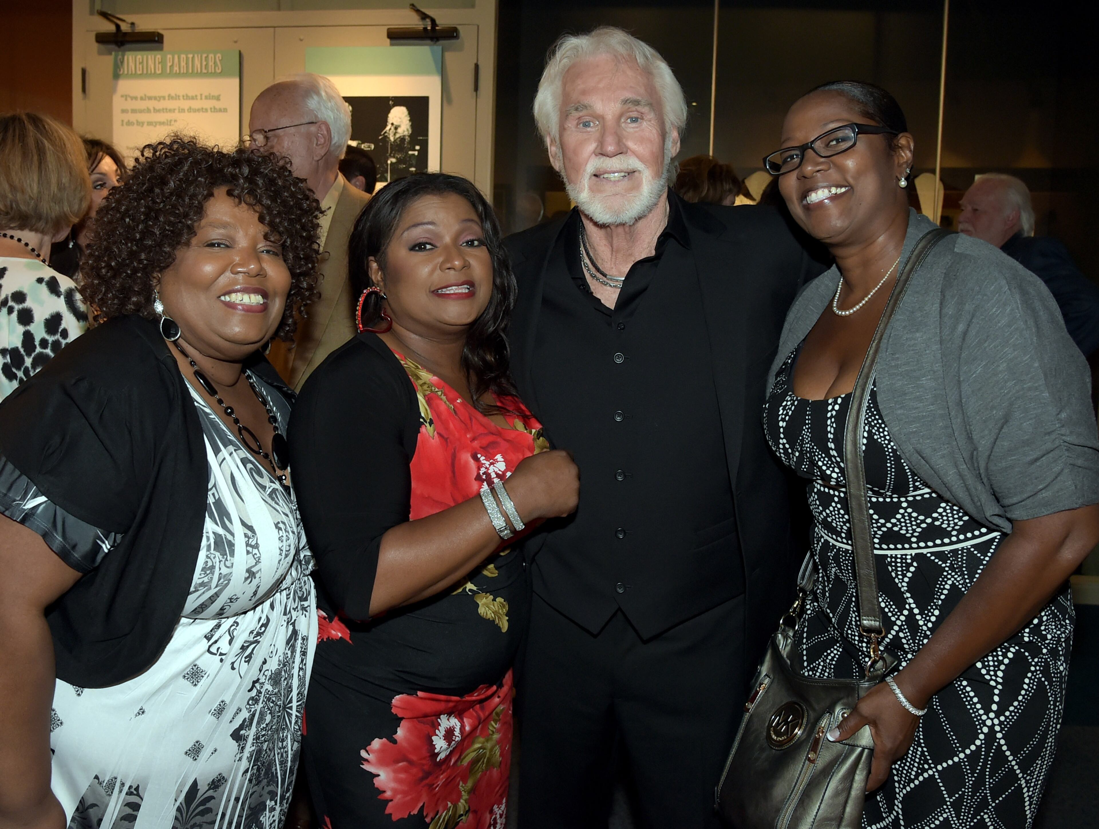 NASHVILLE, TN - AUGUST 13: Recording Artists The McCary Sisters and Country Music Hall of Fame Member Kenny Rogers attend the Country Music Hall of Fame Kenny Rogers Exhibit Opening Reception at the Country Music Hall of Fame and Museum on August 13, 2014 in Nashville, Tennessee. (Photo by Rick Diamond/Getty Images for the Country Music Hall of Fame and Museum)