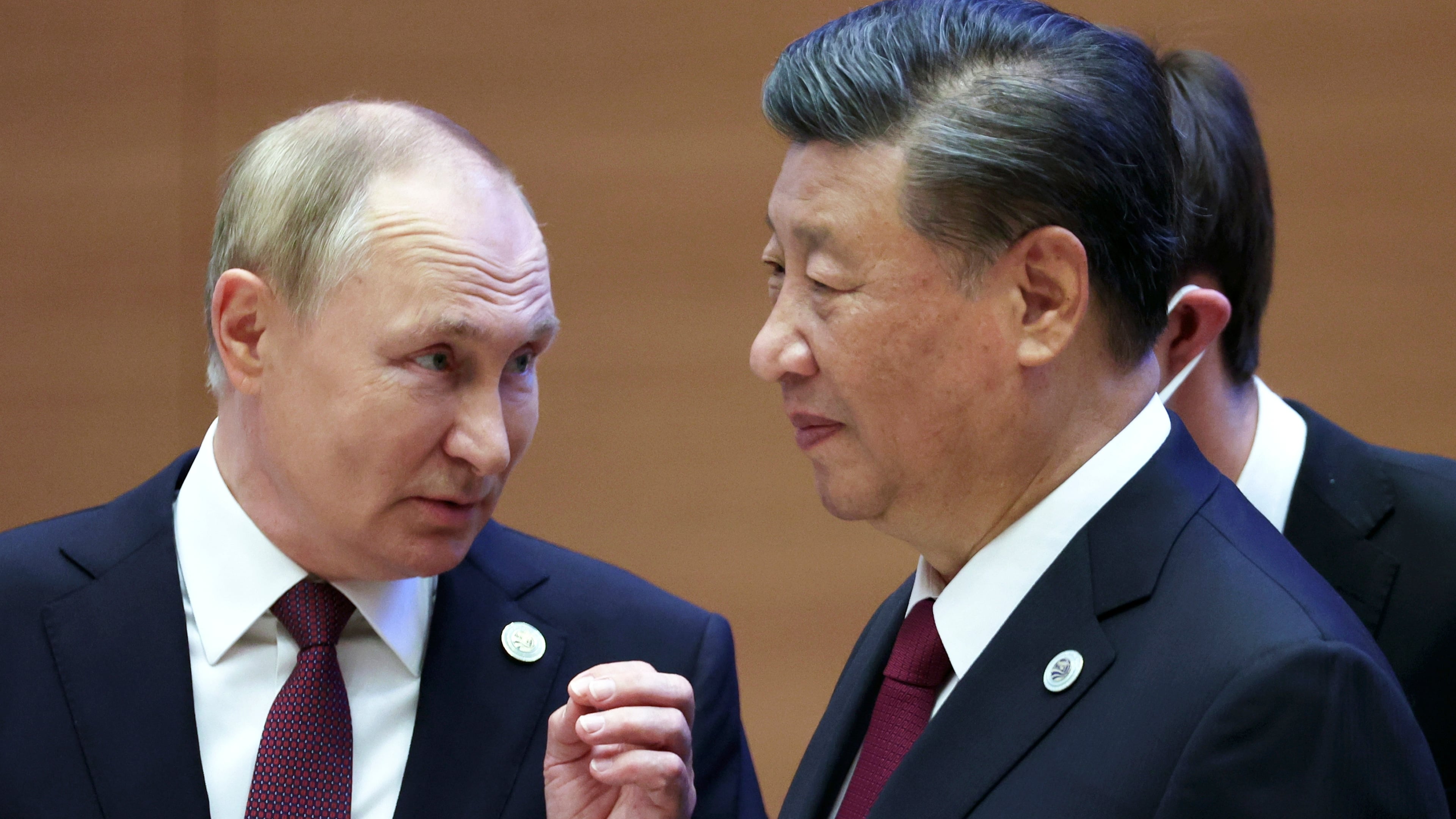 FILE - Russian President Vladimir Putin, left, gestures while speaking to Chinese President Xi Jinping during the Shanghai Cooperation Organization (SCO) summit in Samarkand, Uzbekistan, Sept. 16, 2022. (Sergei Bobylev, Sputnik, Kremlin Pool Photo via AP, File)