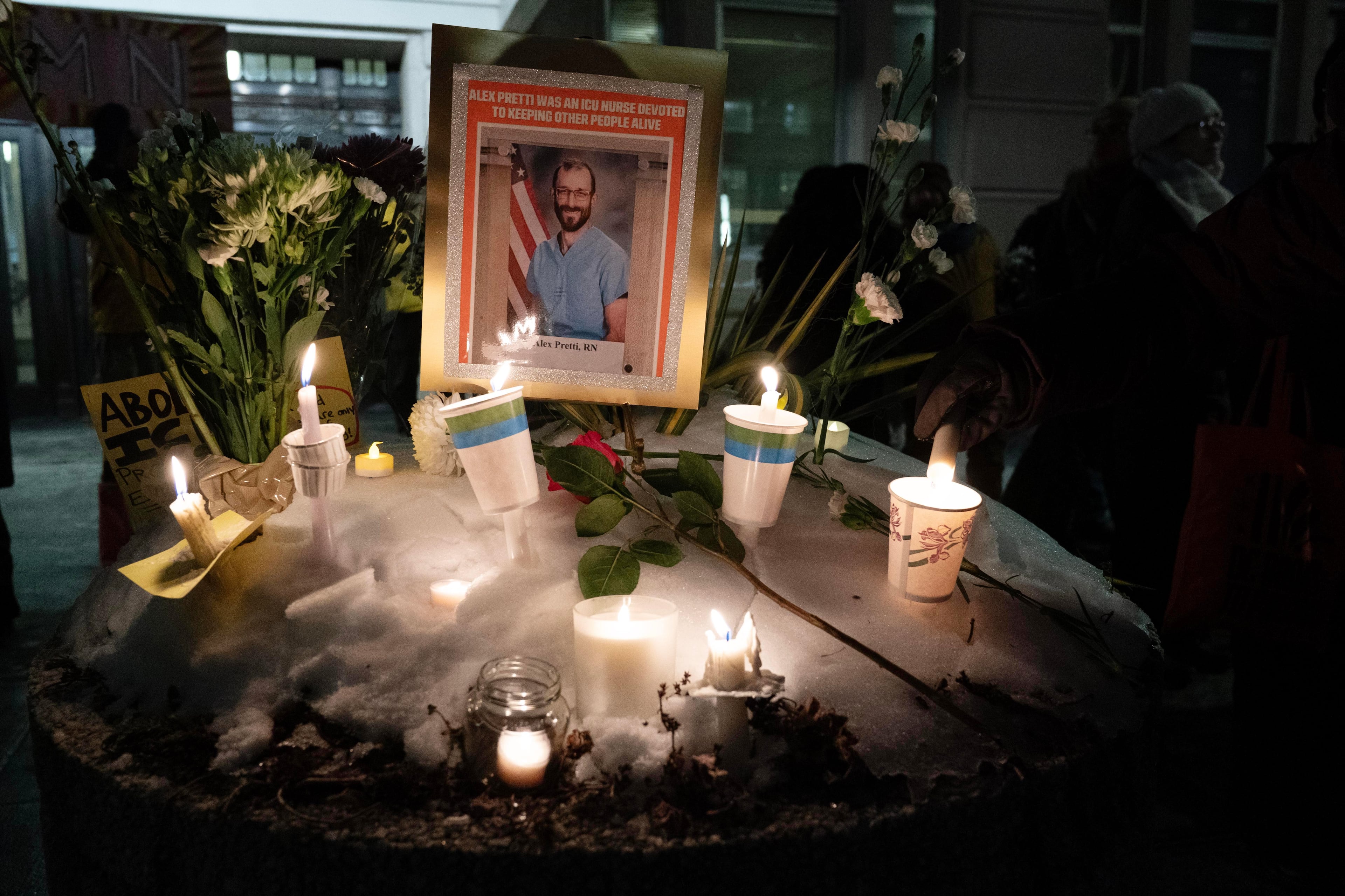 Demonstrators light candles for Alex Pretti during a candlelight vigil outside of the Veterans Affairs headquarters in Washington, Wednesday, Jan. 28, 2026. (Jose Luis Magana/AP)