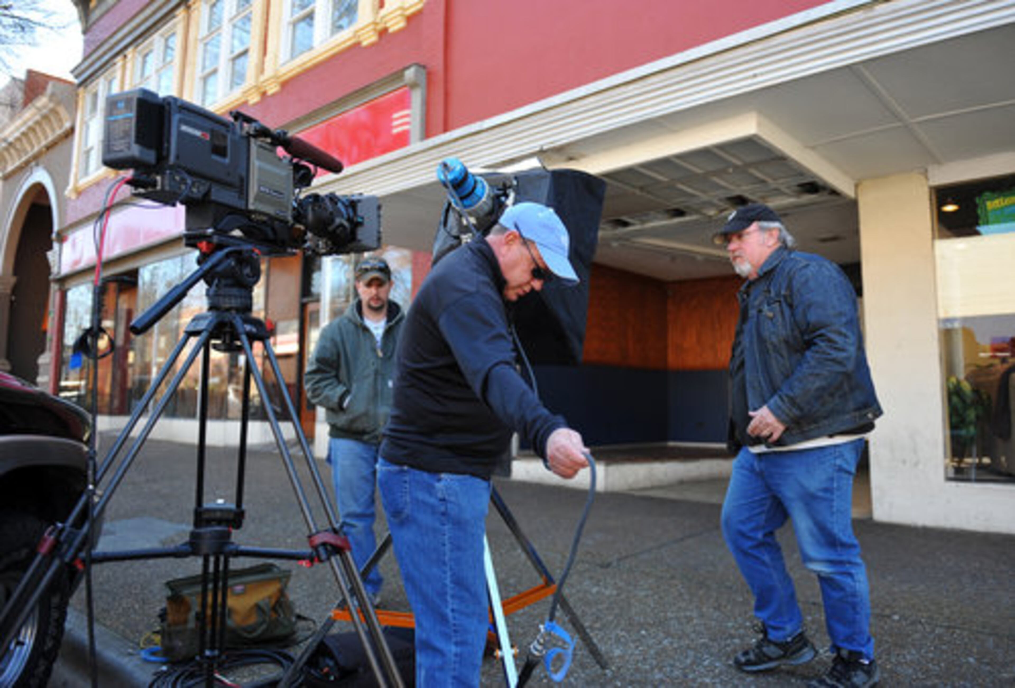 A film crew contracted by ESPN sets up for a shot outside the Capital City night club.