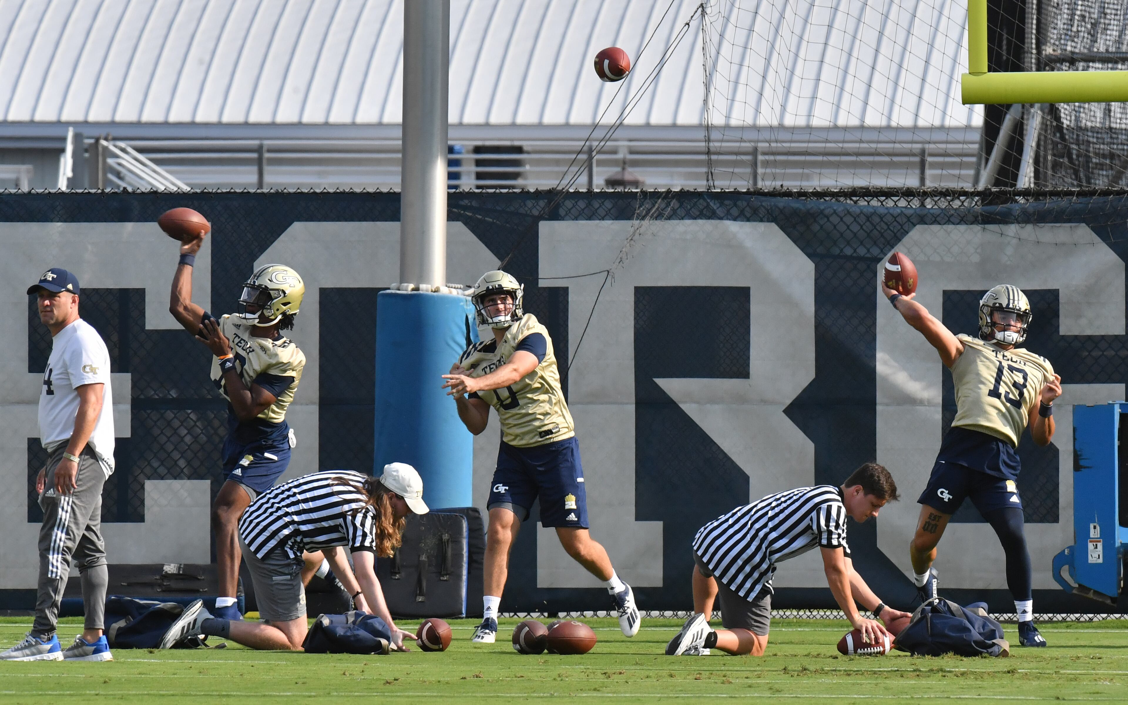 Georgia Tech's quarterbacks (from left) Jeff Sims, Ryan Lantz and Jordan Yates (13) throw during a football practice at Rose Bowl Field on Georgia Tech Campus in Atlanta on Friday, August 6, 2021. (Hyosub Shin / Hyosub.Shin@ajc.com)