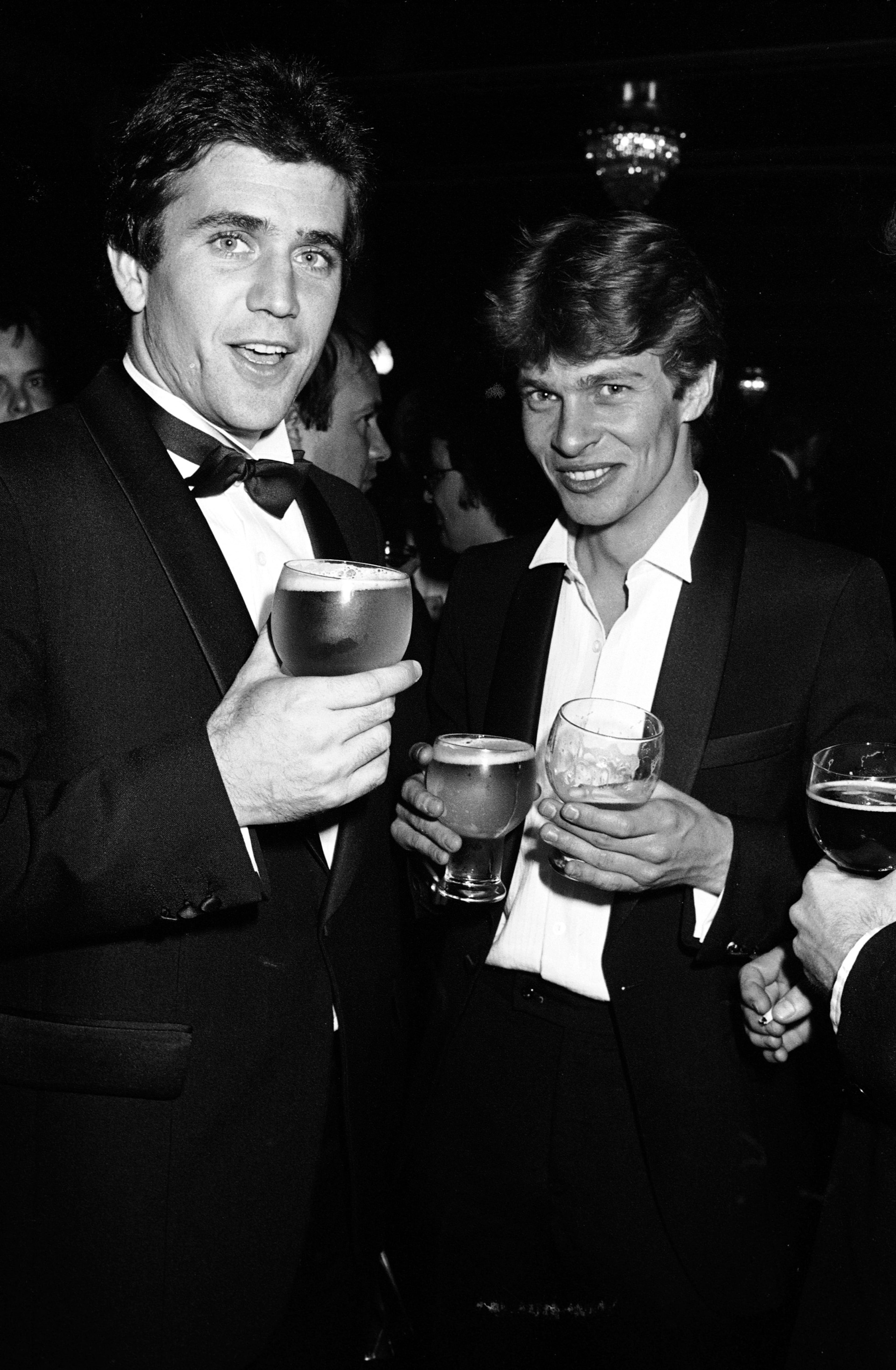 SYDNEY, AUSTRALIA - 1981: American actor Mel Gibson and actor Mark Lee celebrate Mel's AFI award for his role in the movie "Gallipoli" at the Australian Film Industry Awards 1981 in Sydney, Australia. (Photo by Patrick Riviere/Getty images)