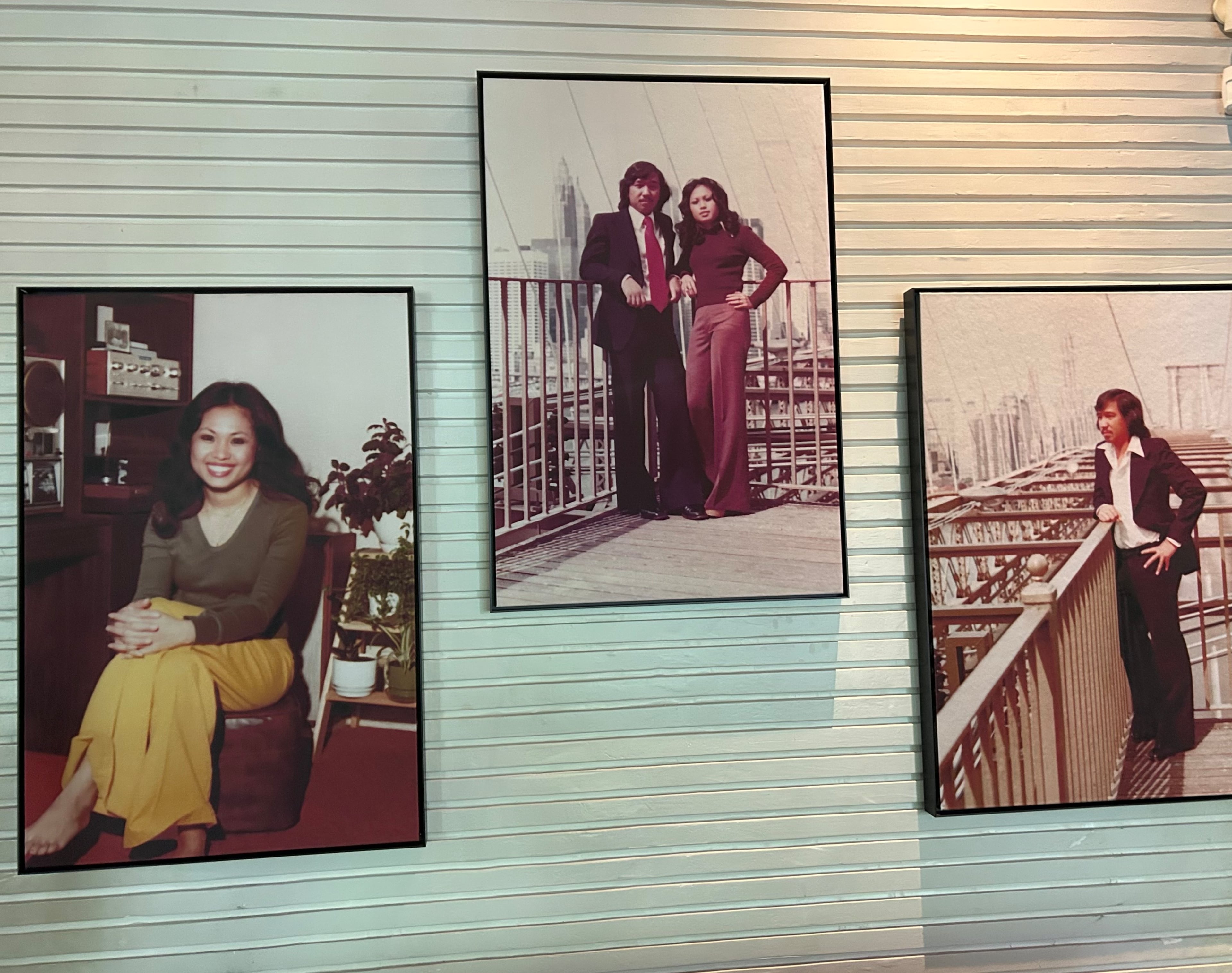 DeeDee Niyomkul hung photos of her mother and father, Nan and Charlie Niyomkul, in her restaurant, Nan Thai Buckhead. (Olivia Wakim/AJC)