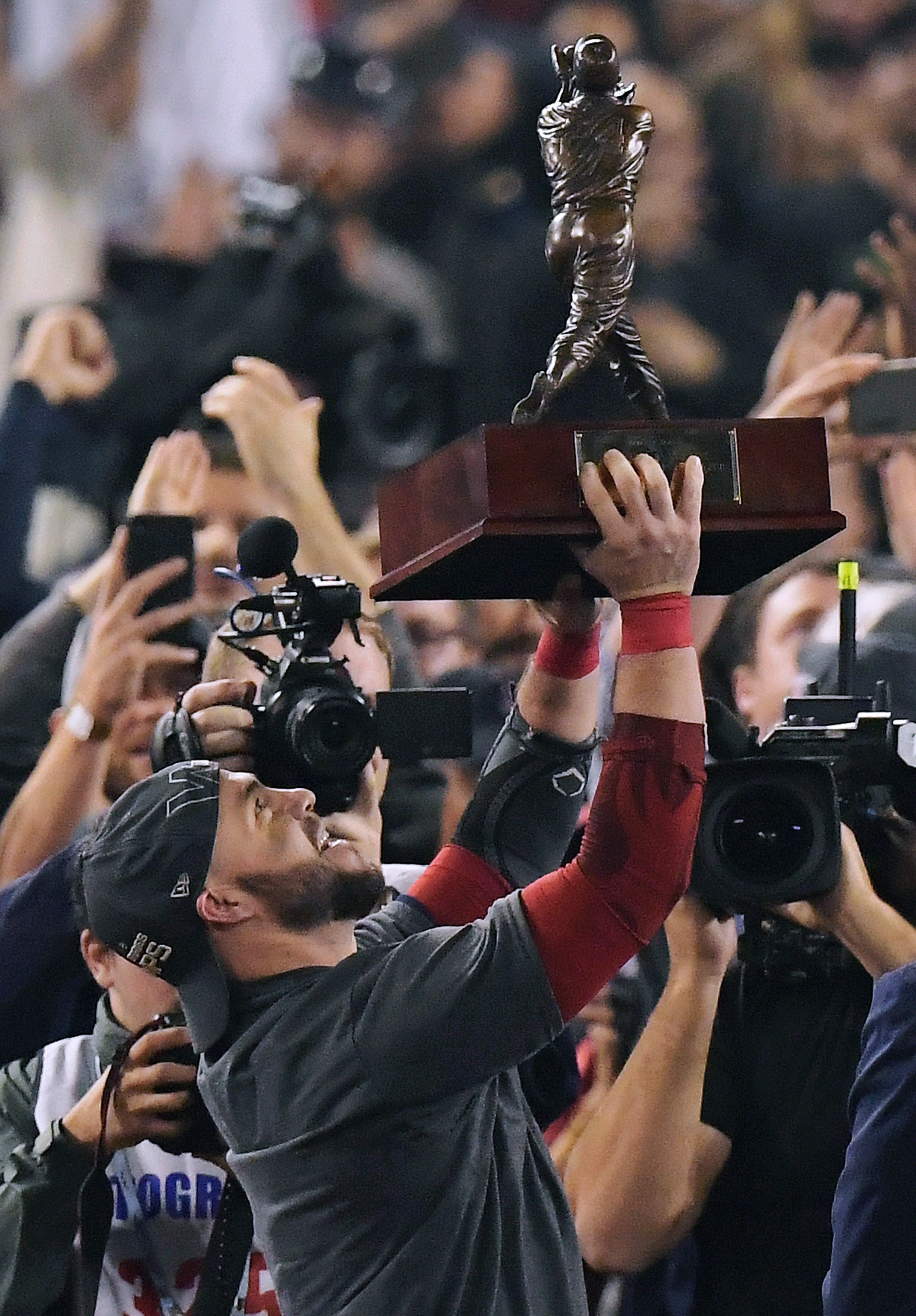 Boston Red Sox's Steve Pearce holds the MVP trophy after Game 5 of baseball's World Series against the Los Angeles Dodgers on Sunday, Oct. 28, 2018, in Los Angeles. The Red Sox won 5-1 to win the series 4 game to 1. (AP Photo/Mark J. Terrill)