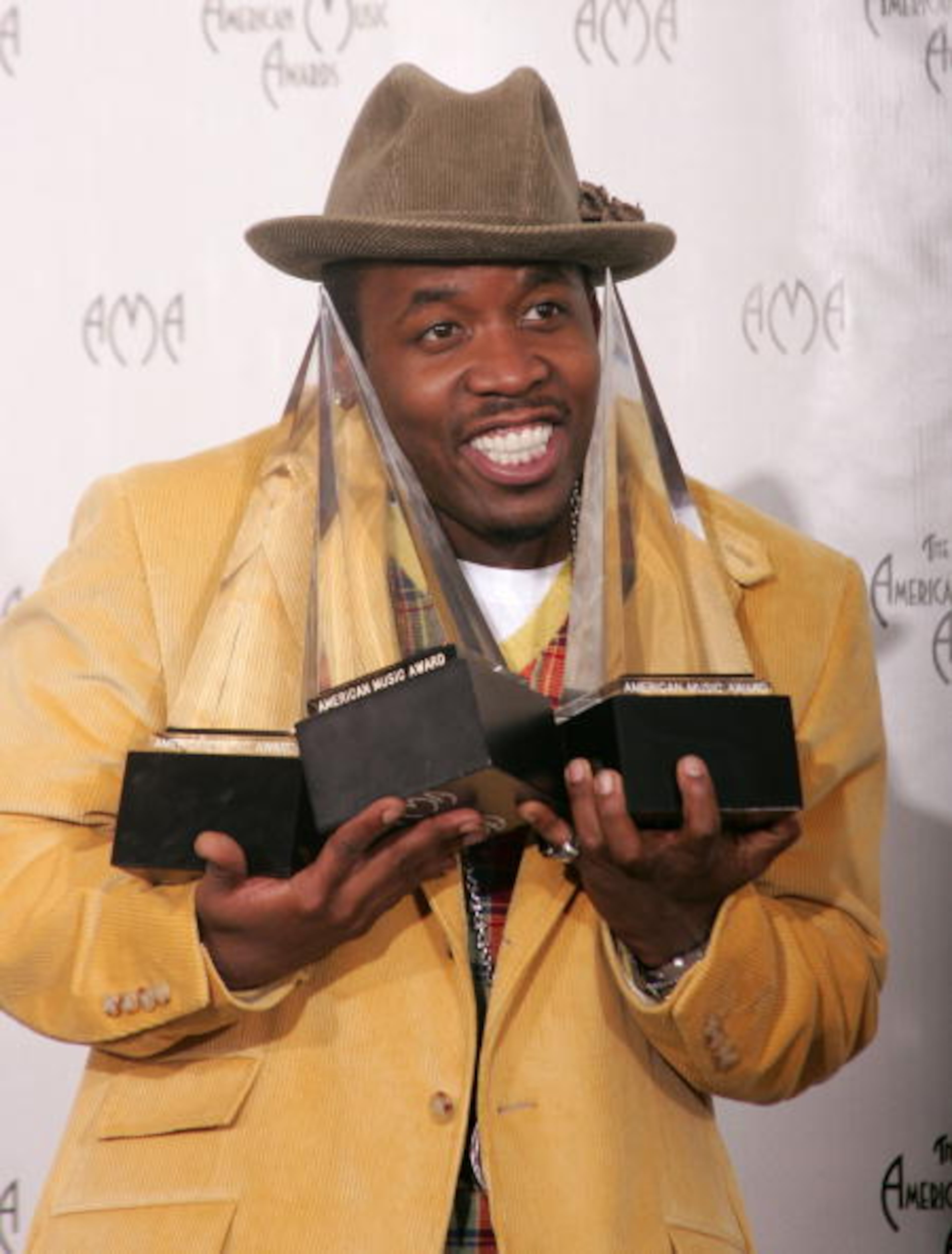 LOS ANGELES, CA - NOVEMBER 14: Musician Big Boi of Outkast poses with his awards in the press room at the 32nd Annual "American Music Awards" at the Shrine Auditorium November 14, 2004 in Los Angeles, California. (Photo by Carlo Allegri/Getty Images)