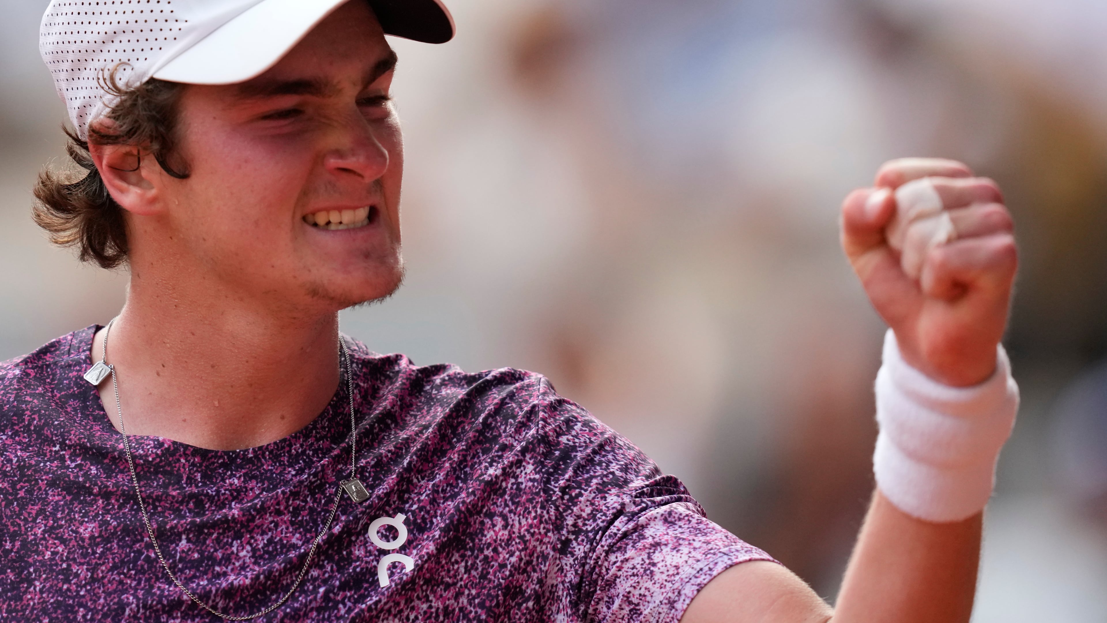 Joao Fonseca of Brazil reacts as he plays against Novak Djokovic of Serbia during their third round men's singles tennis match at the French Open tennis tournament in Paris, Friday, May 29, 2026. (AP Photo/Christophe Ena)