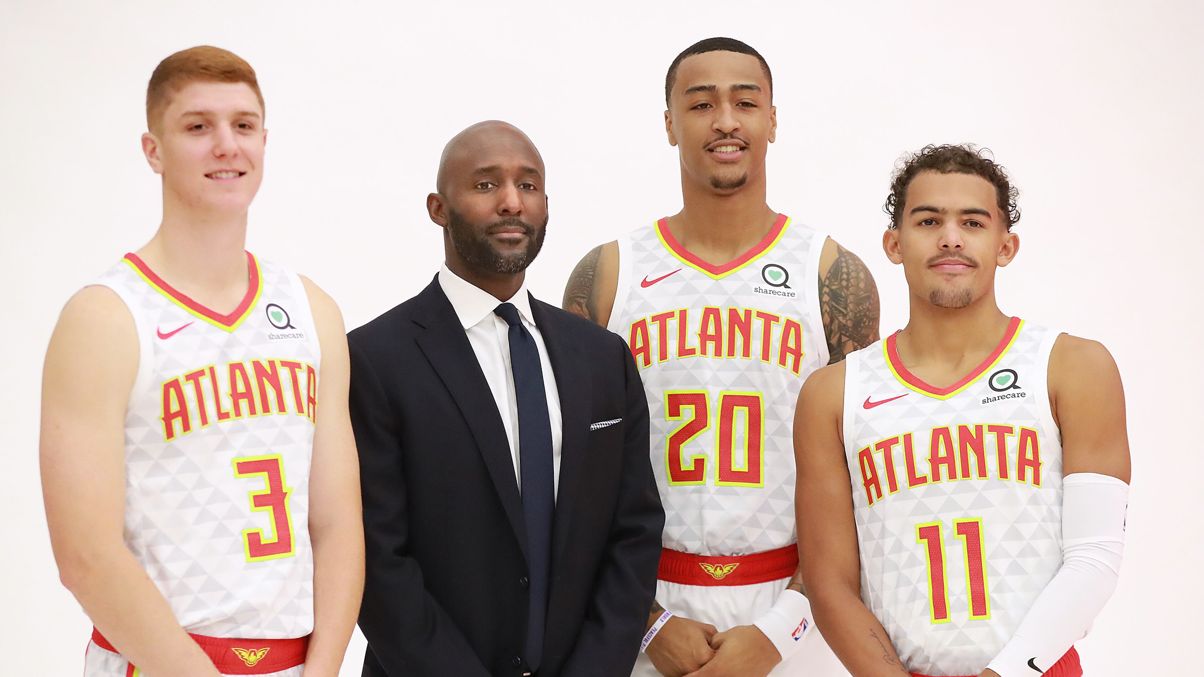 September 30, 2019 Atlanta: Atlanta Hawks Kevin Huerter (from left), head coach Lloyd Pierce, John Collins and Trae Young pose for a team portrait during media day on Monday, Sept. 30, 2019, in Atlanta. Curtis Compton/ccompton@ajc.com