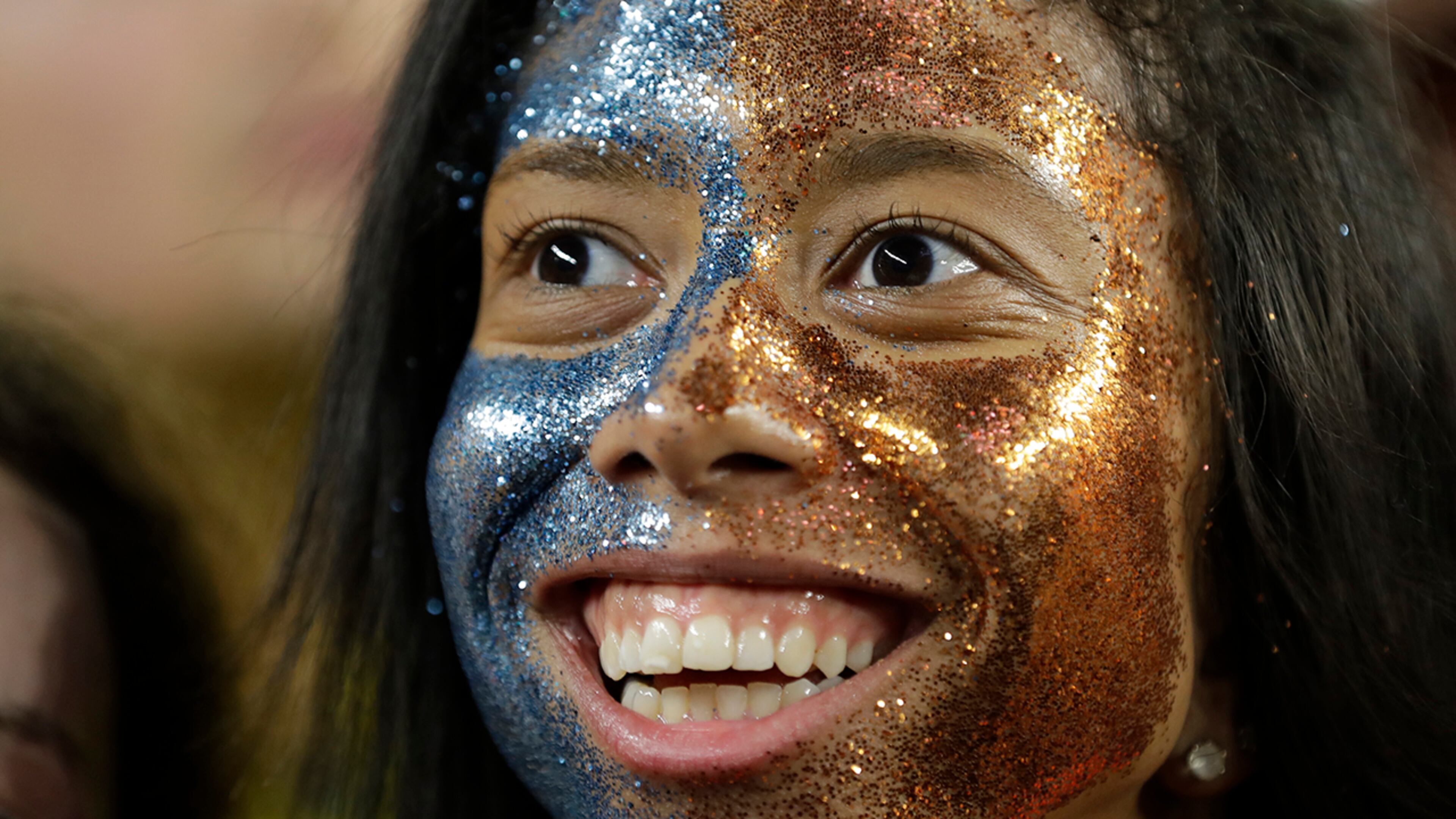 Virginia fans cheer before the championship of the Final Four NCAA college basketball tournament between Texas Tech and Virginia, Monday, April 8, 2019, in Minneapolis.