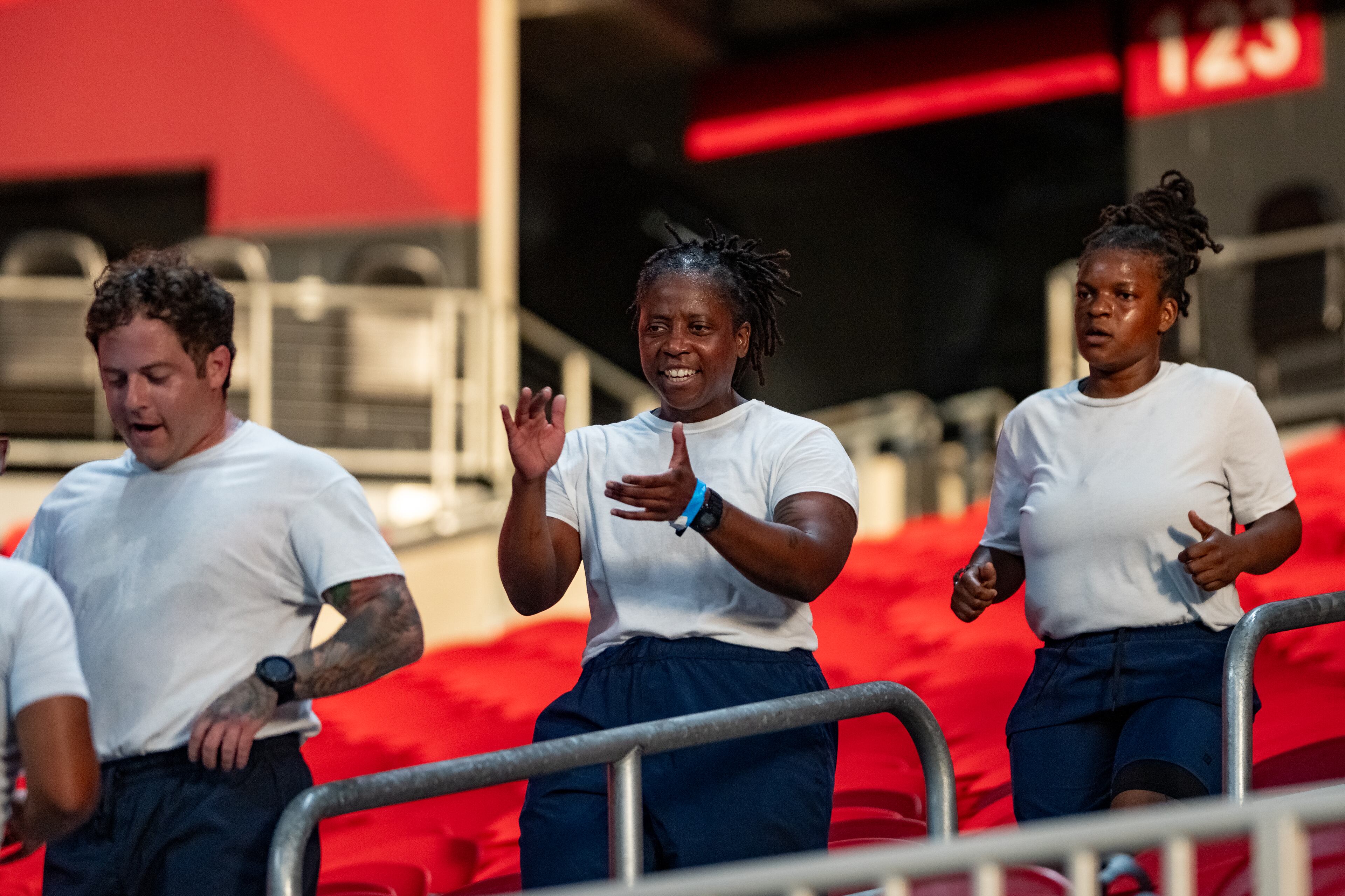 An Atlanta Police cadets cheers on her team as they participate in the 911 Memorial Stair Climb at Mercedes-Benz Stadium on the 24th anniversary of the attacks. Thursday, September 11, 2025 (Ben Hendren for the AJC)