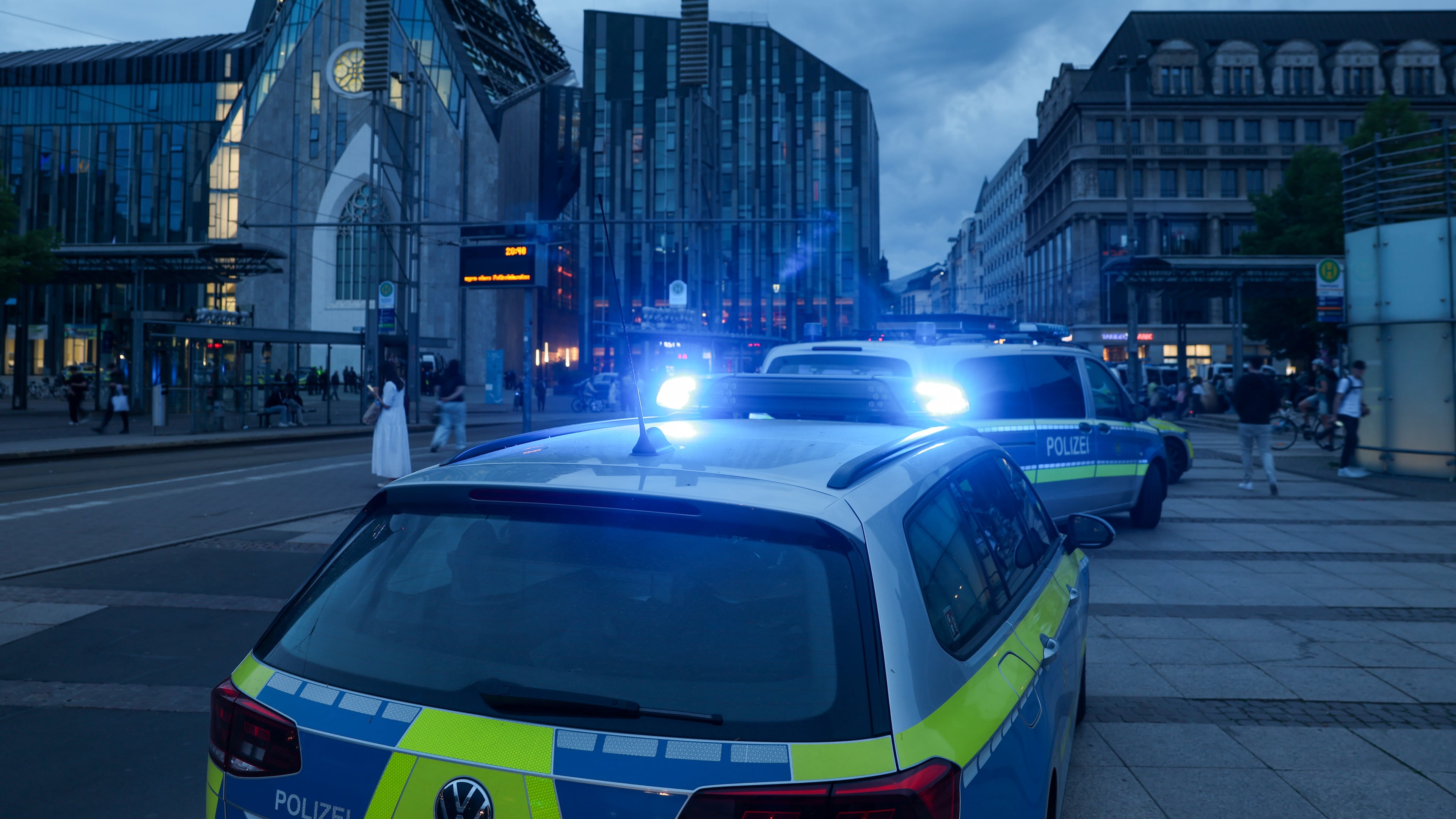 Emergency services stand at the entrance to Grimmaische station in Leipzig, Germany, Monday, May 4, 2026. (Jan Woitas/dpa via AP)